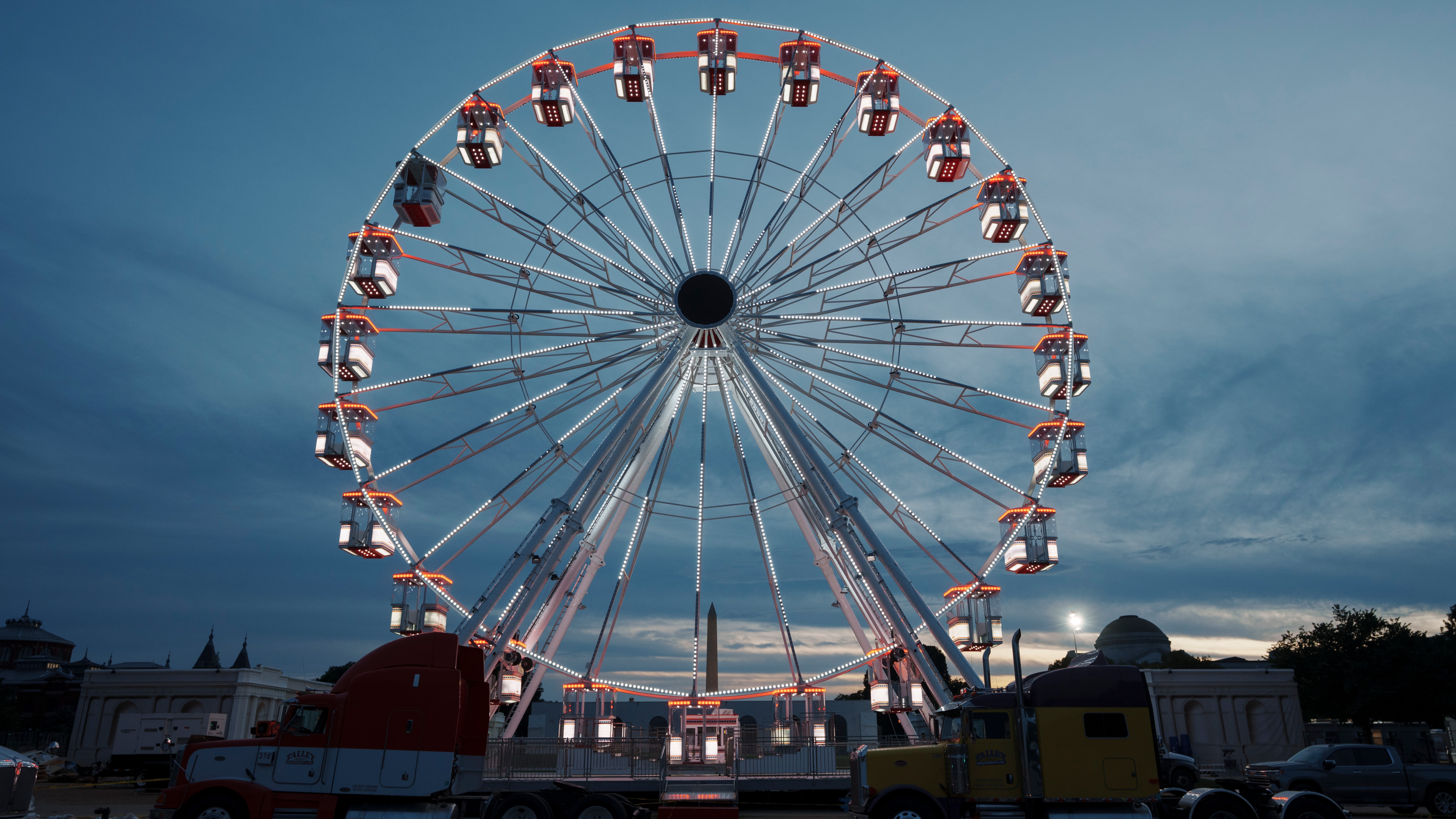 The ferris wheel on the National Mall is lit as preparation continues for the Great American State Fair on the National Mall, Sunday, June 21, 2026, in Washington.