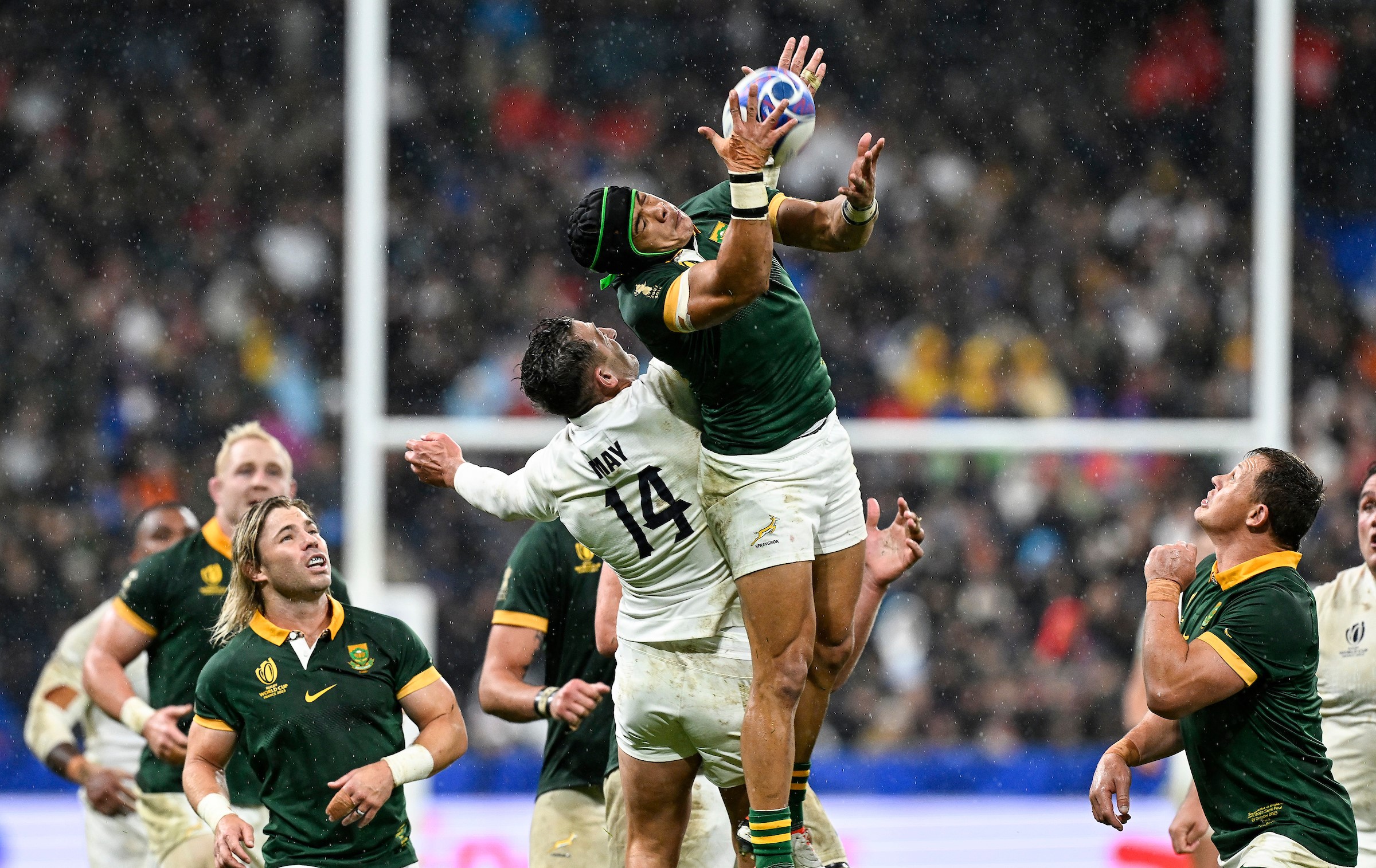 England wing Jonny May puts pressure on Cheslin Kolbe as the rain falls at the Stade de France.