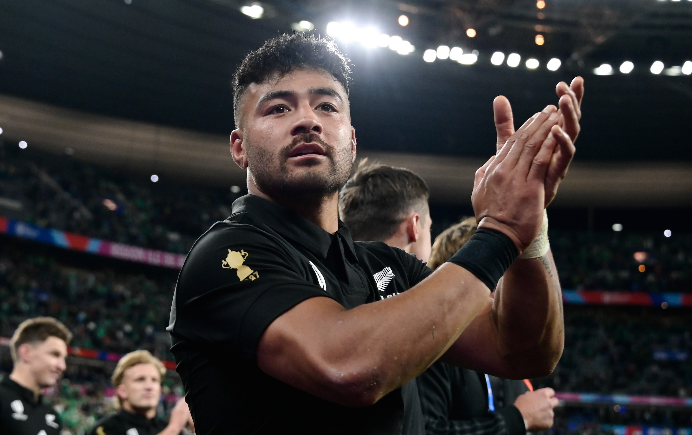 Richie Mo'unga applauds the Stade de France crowd after the All Blacks' World Cup quarter-final victory over Ireland in 2023.