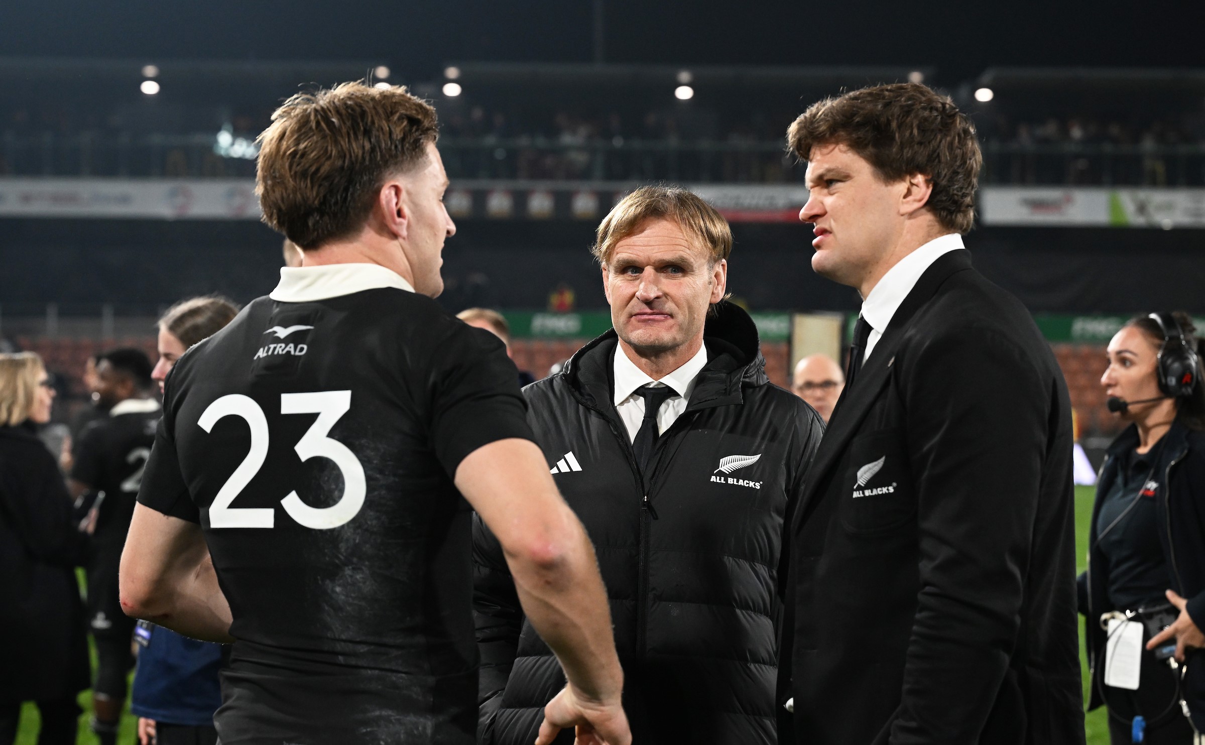 All Blacks head coach Scott Robertson talks to Jordie Barrett, left, and Scott Barrett after the Test win over France in Hamilton.