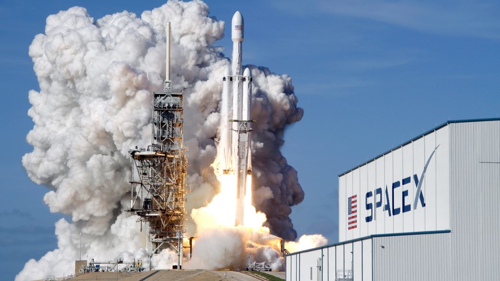 A Falcon 9 SpaceX heavy rocket lifts off from pad 39A at the Kennedy Space Center in Cape Canaveral, Fla., Tuesday, Feb. 6, 2018.