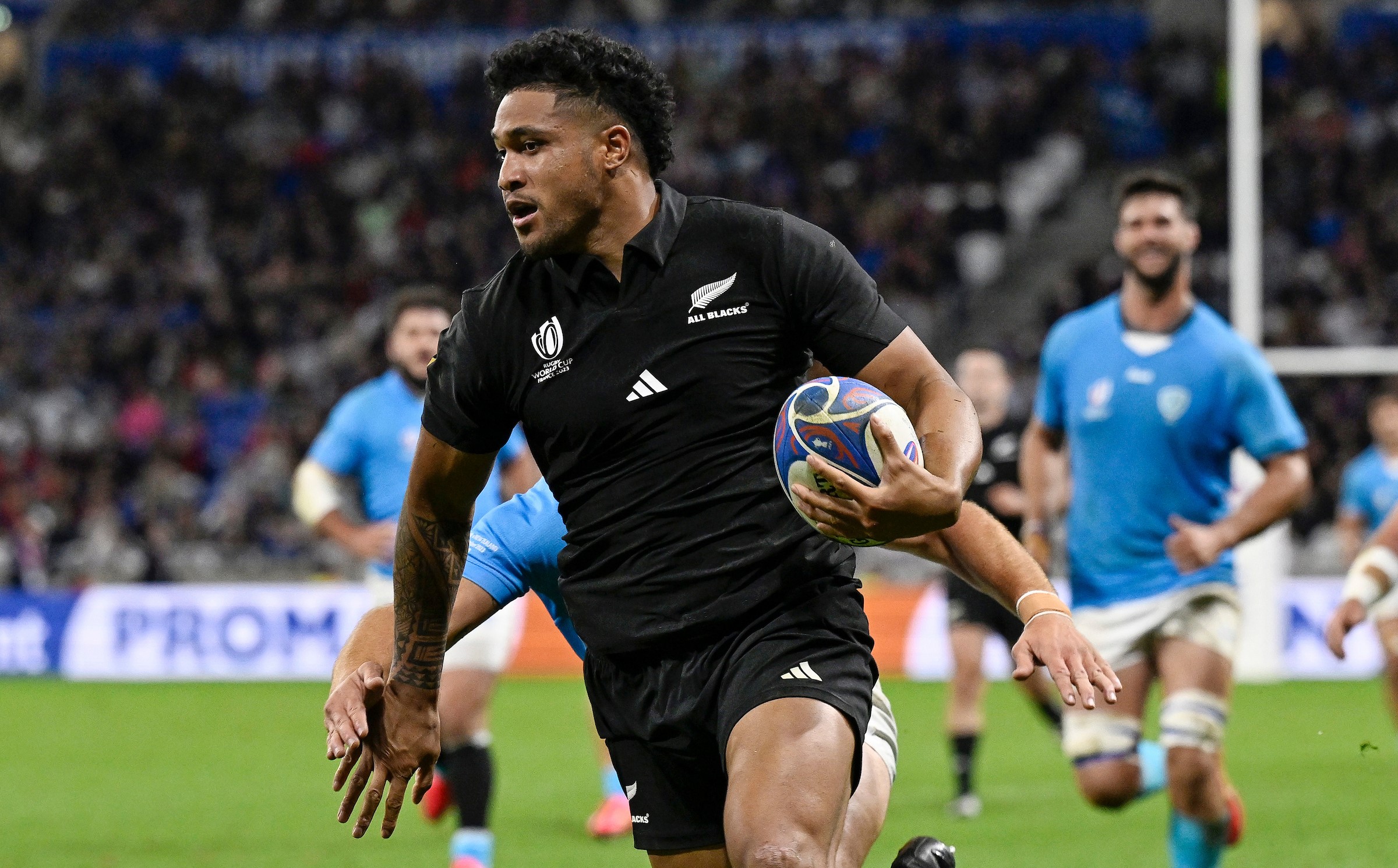 Leicester Fainga'anuku scores for the All Blacks against Uruguay in the 2023 World Cup.