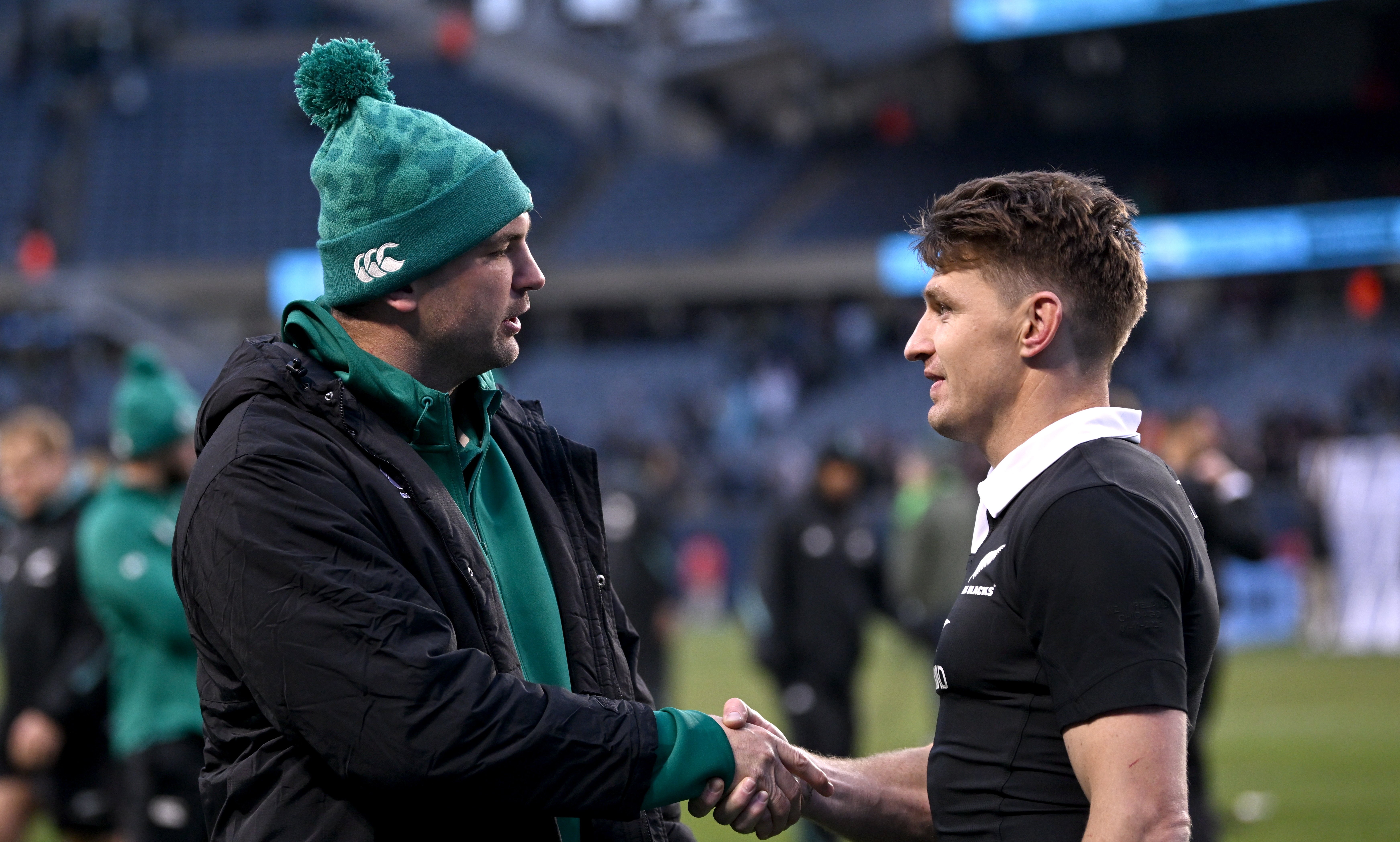 Beauden Barrett shakes hands with red-carded lock Tadhg Beirne after the Test at Soldier Field.
