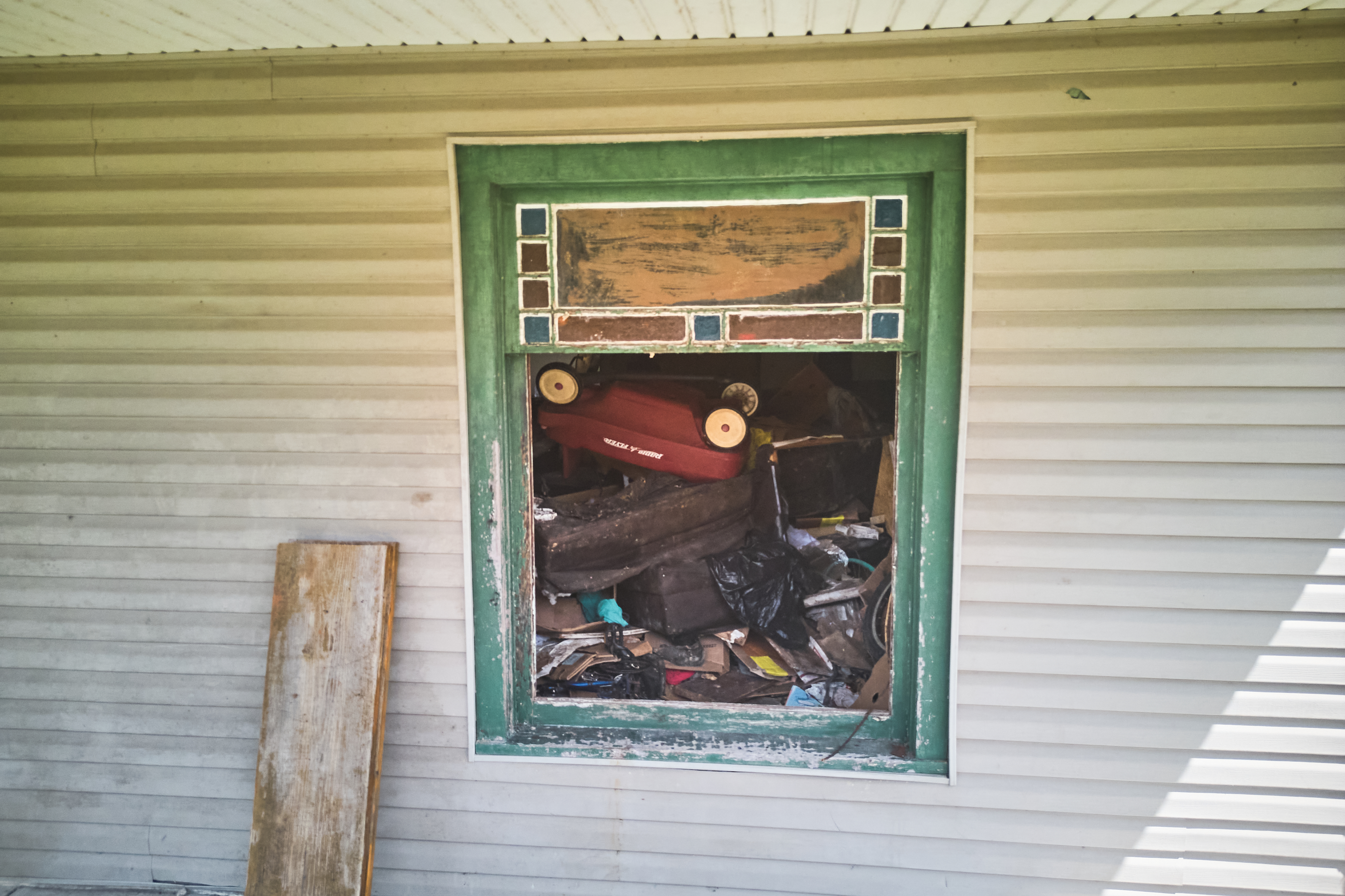Debris is seen inside a home where authorities say they removed 16 children and arrested four adults in Hamden, Ohio, Wednesday, July 1, 2026.