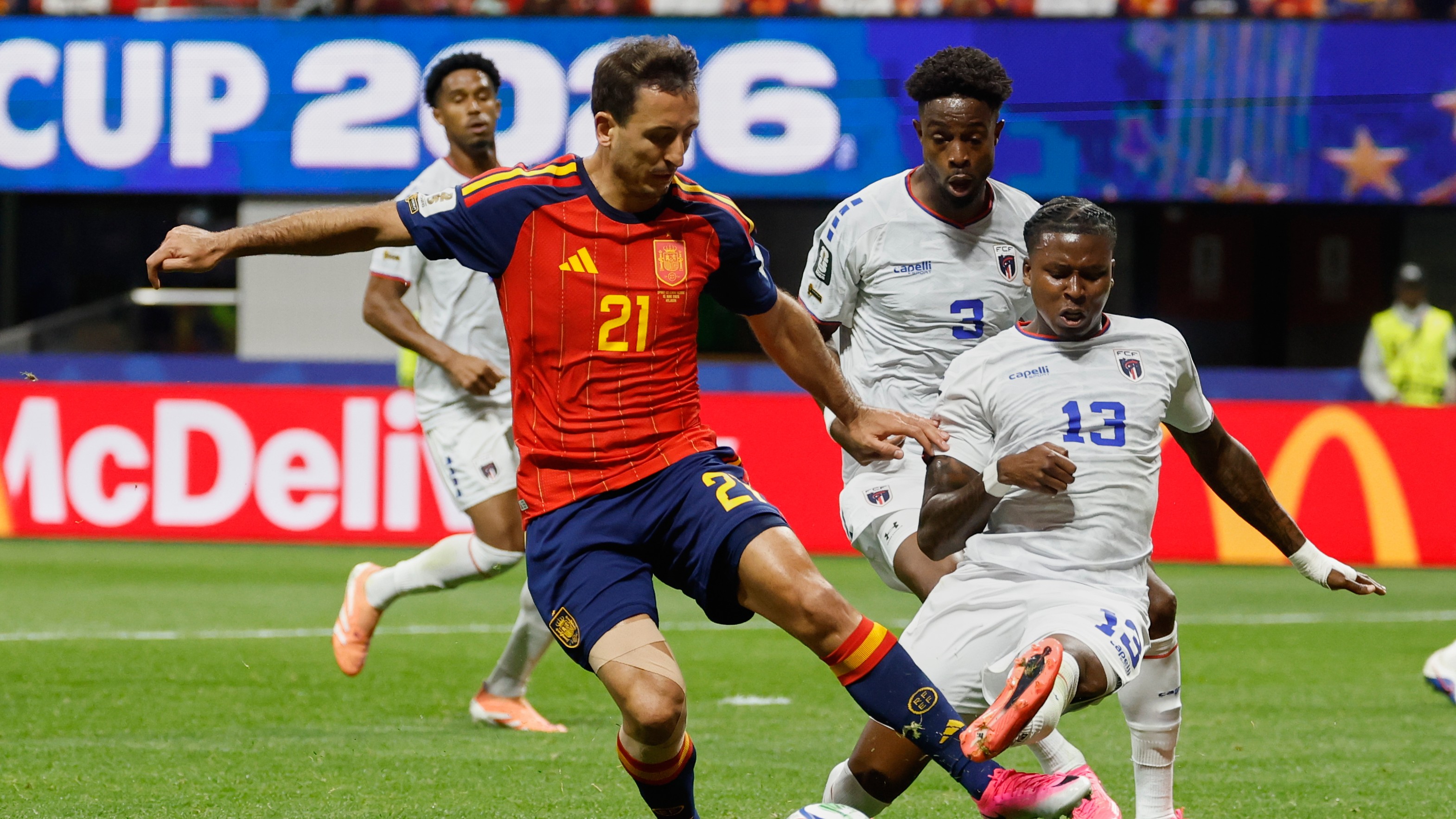 Spain's Mikel Oyarzabal, left, and Cabo Verde's Sidny Lopes Cabral fight for the ball during the World Cup Group H soccer match between Spain and Cape Verde.
