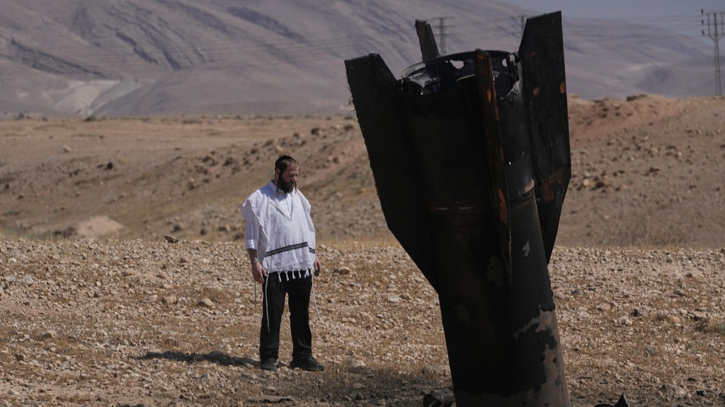 A man look at the wreckage of an Iranian missile that landed near the West Bank city of Jericho Monday, June 8, 2026.