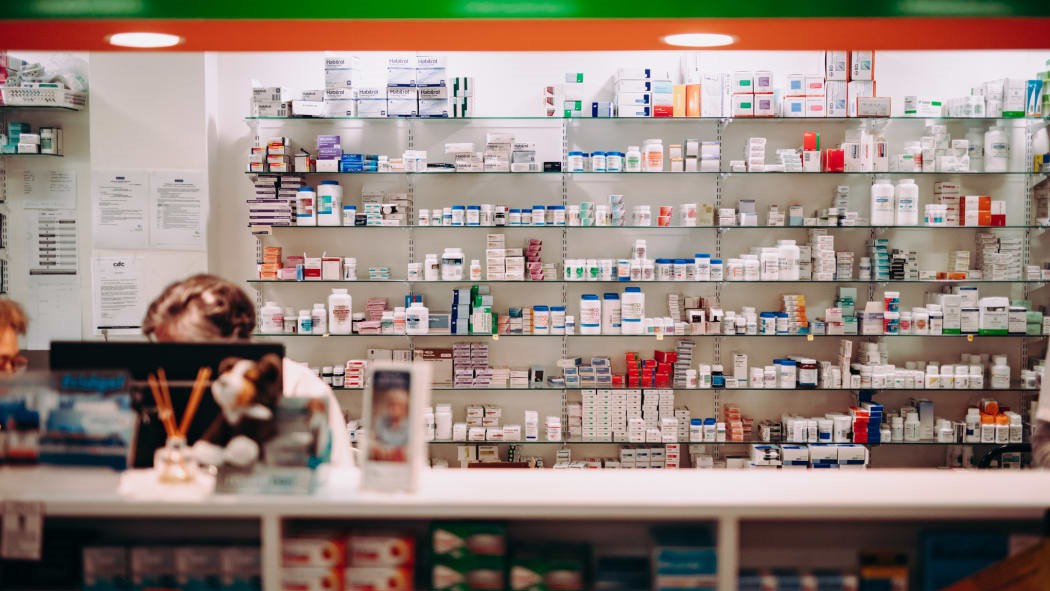 Drugs behind chemist counter.