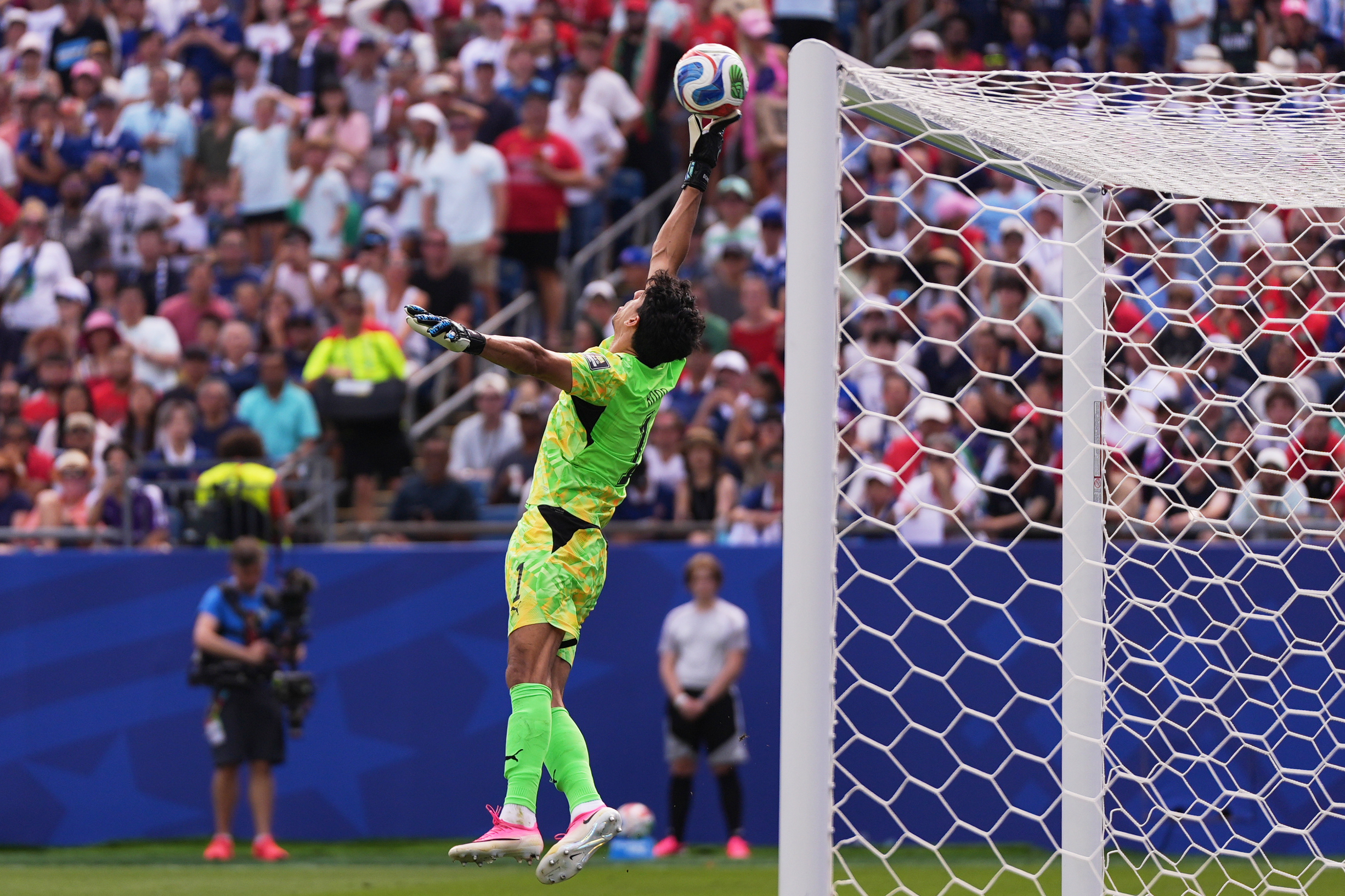 Morocco goalkeeper Yassine Bounou (1) reaches for the ball during the World Cup quarterfinal soccer match between France and Morocco.