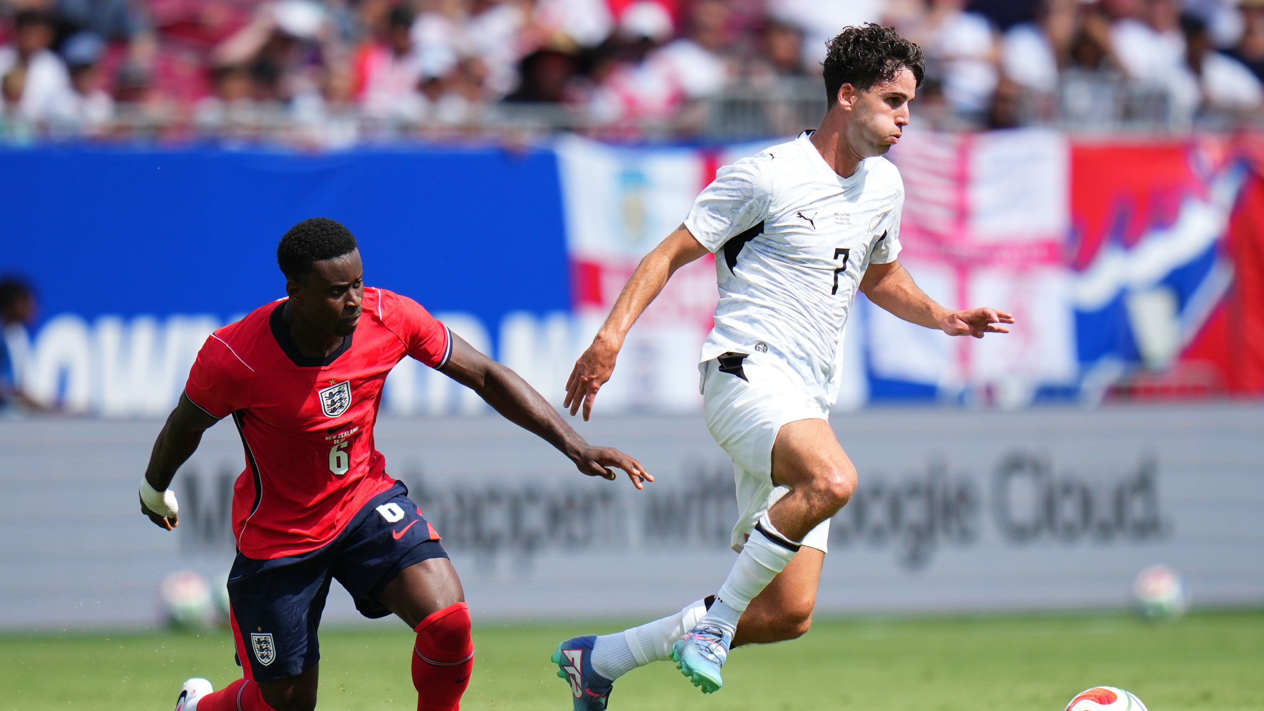 Matthew Garbett runs with the ball from Marc Guehi during the international friendly match between England and New Zealand at Raymond James Stadium on June 06, 2026 in Tampa, Florida. 