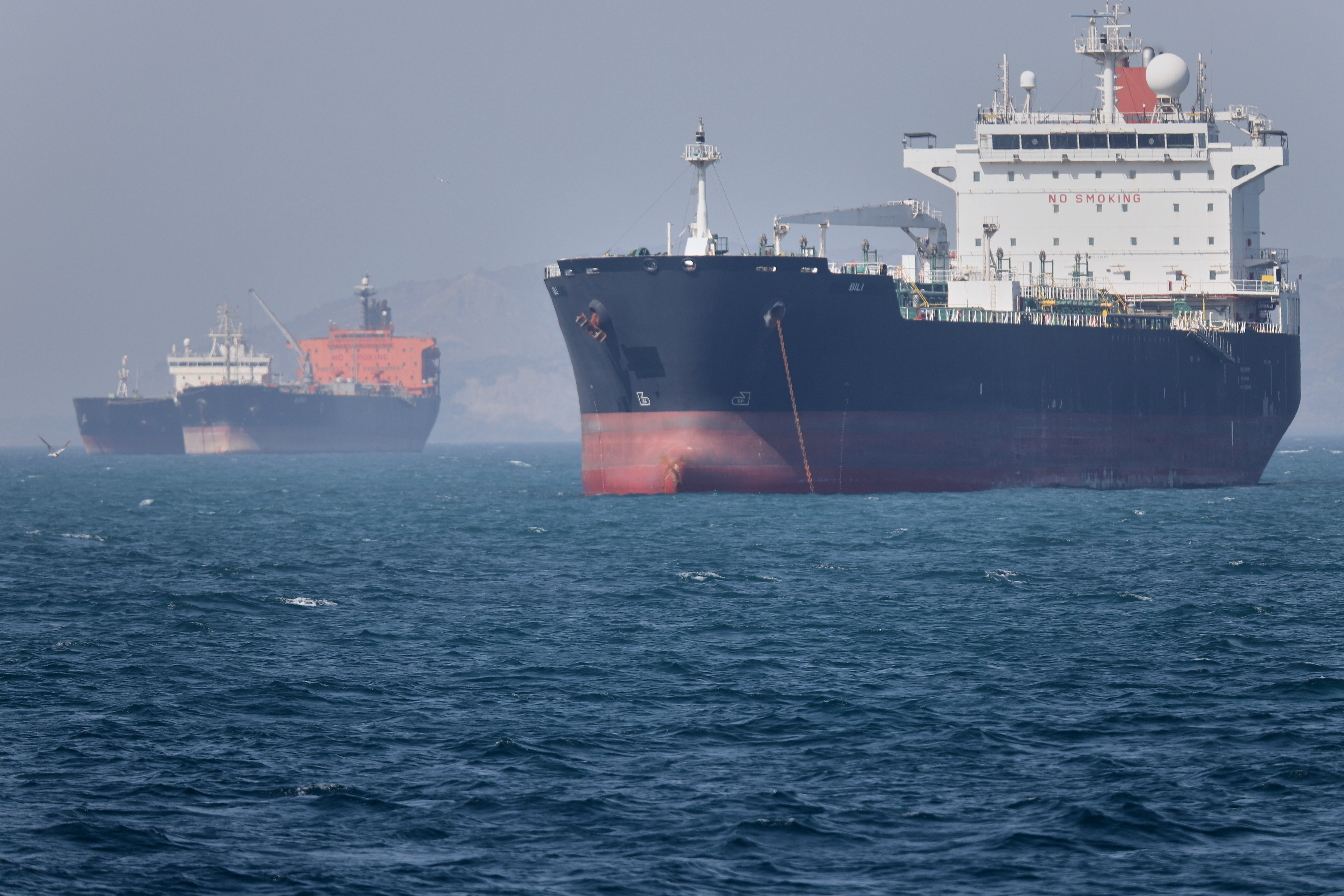 Oil tankers sit at anchor offshore in the Strait of Hormuz off Bandar Abbas, Iran, Saturday, May 2, 2026.