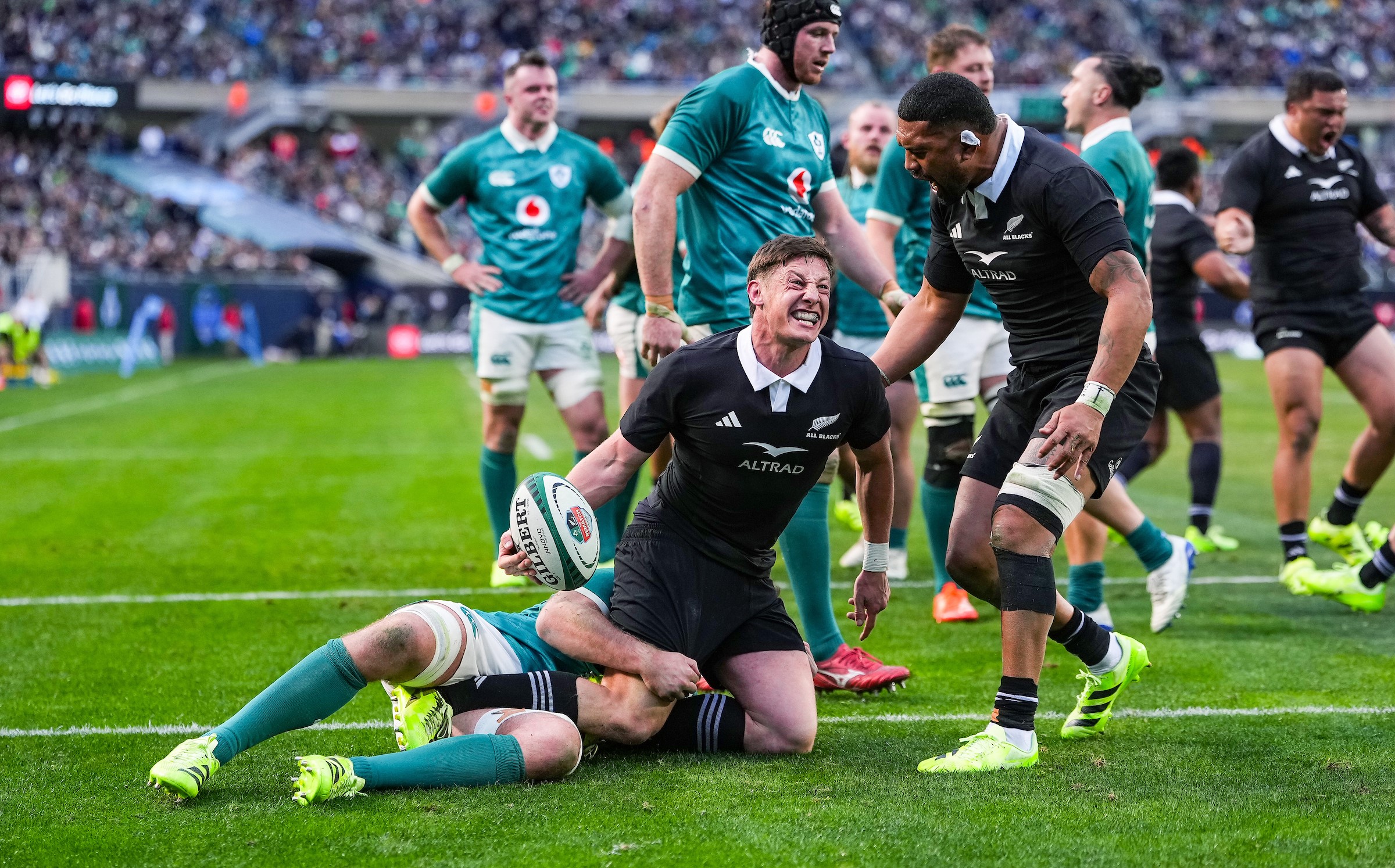 All Blacks halfback Cam Roigard celebrates his try against Ireland.