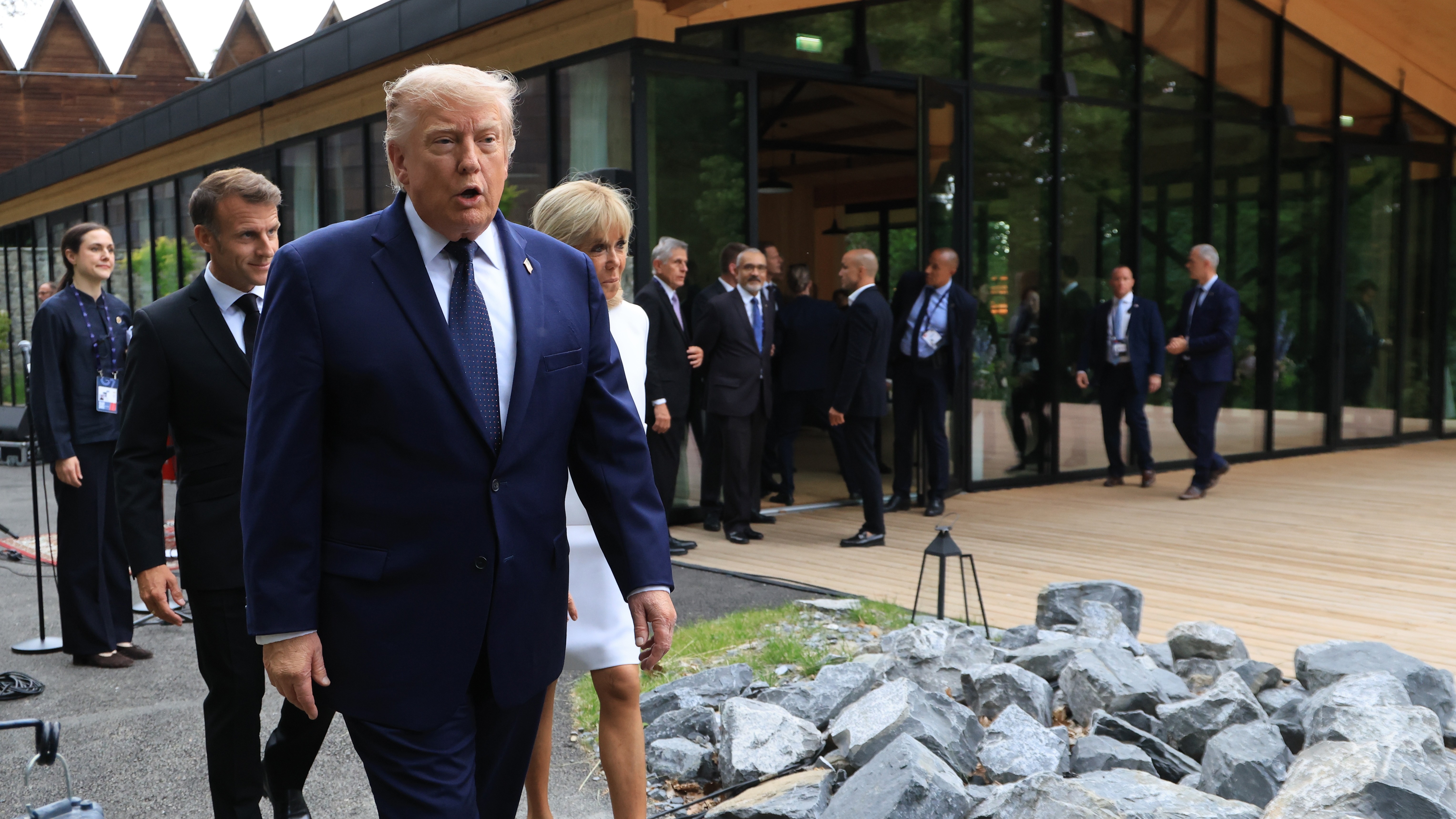 US President Donald Trump walks after posing for a family photo photograph during a gala dinner as part of the G7 summit.
