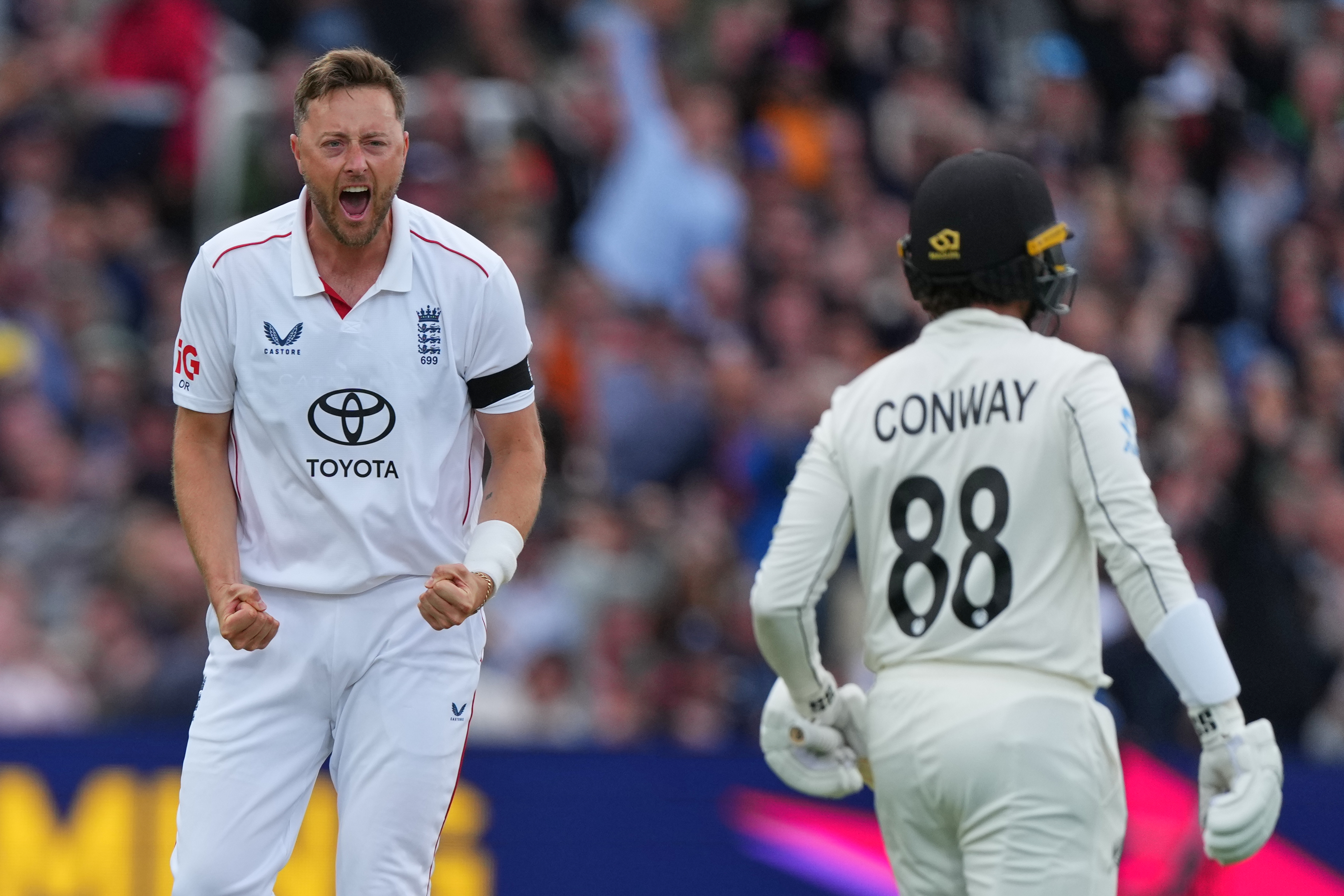 England's Ollie Robinson celebrates taking the wicket of New Zealand's Devon Conway during the first day of the test match between England and New Zealand at Lord's cricket ground in London, Thursday, June 4, 2026.