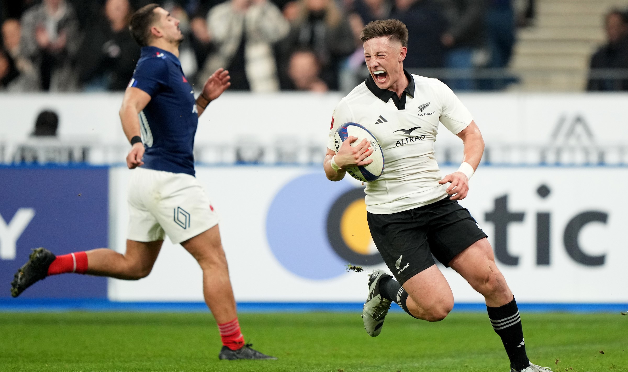 Cam Roigard celebrates as he goes over for a first-half try against France.