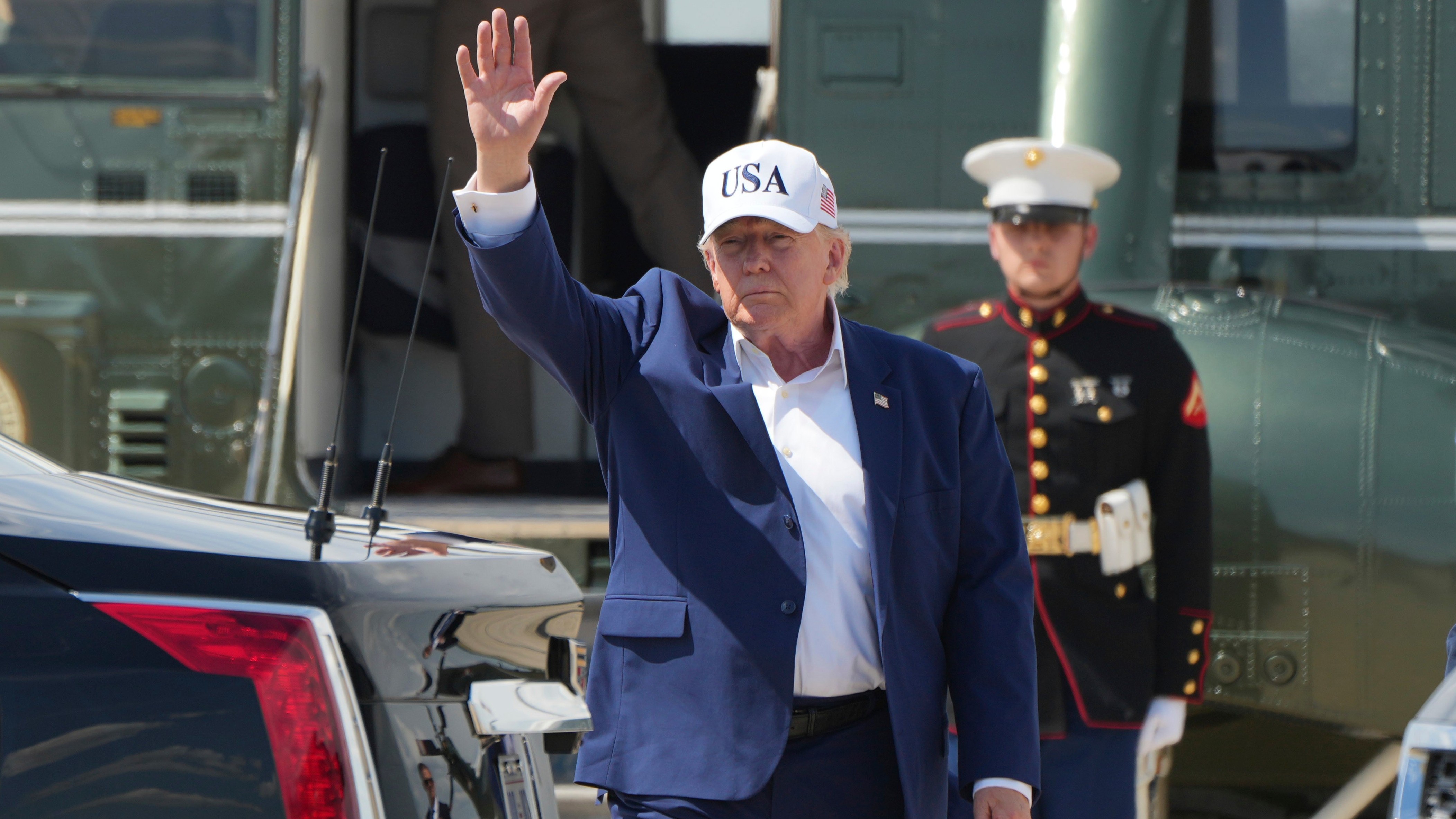 President Donald Trump waves as he arrives on Marine One at Joint Base Andrews, Md., Sunday, June 21, 2026, following a trip to Camp David.