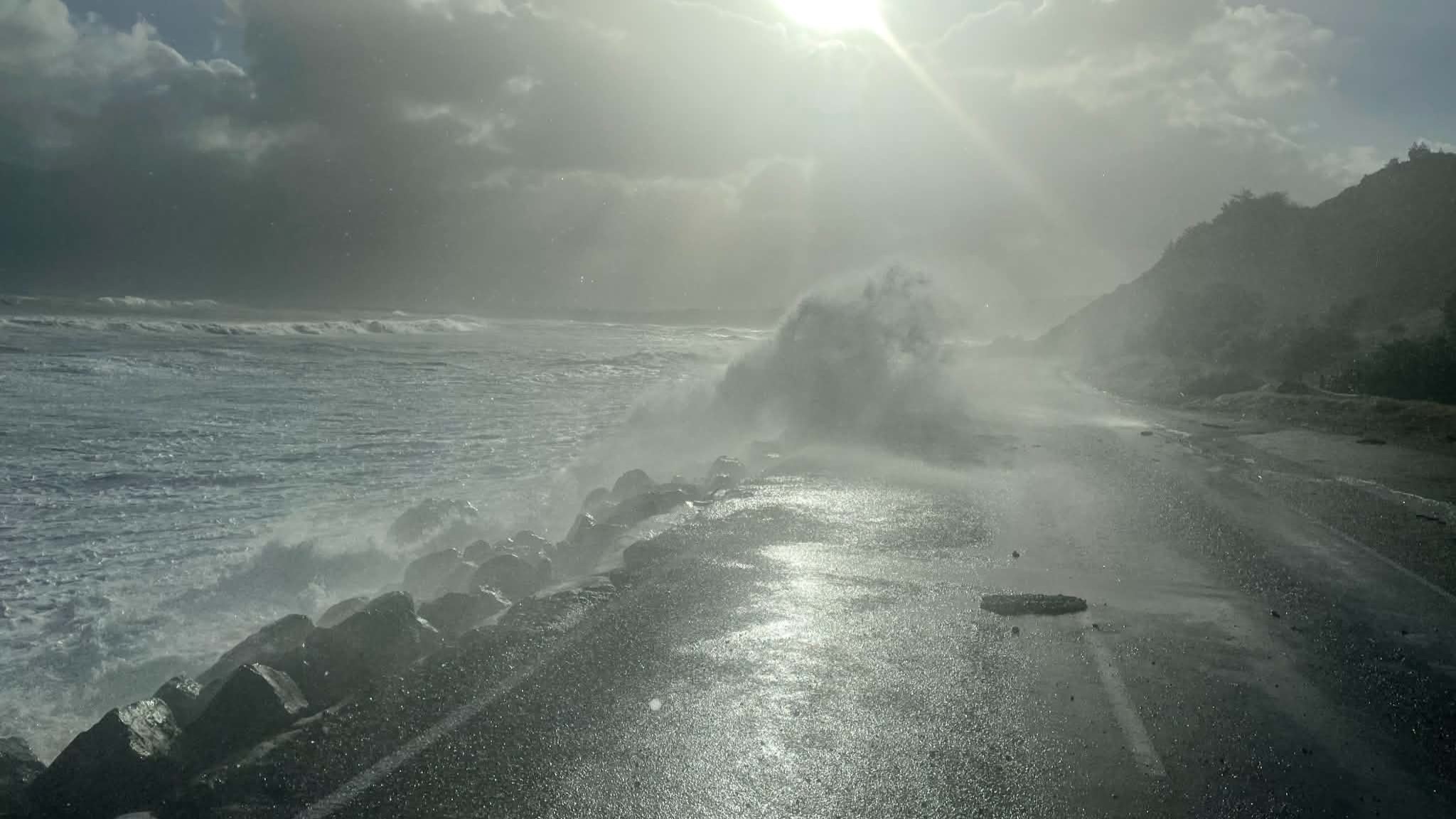 Waves break onto Cape Palliser Rd.