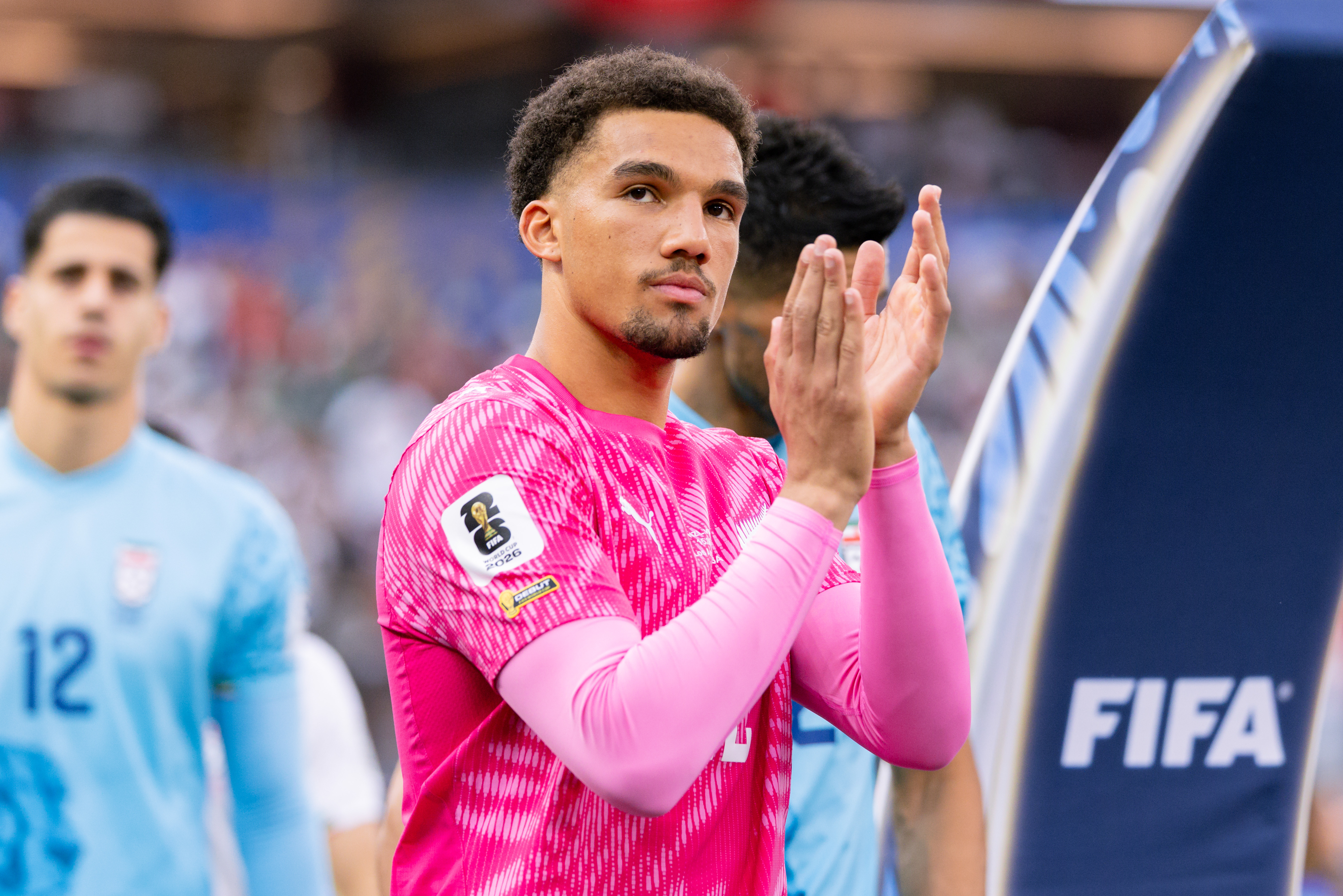 Alex Paulsen claps to the crowd while entering the pitch before the FIFA World Cup 2026 Group G match between IR Iran and New Zealand. 