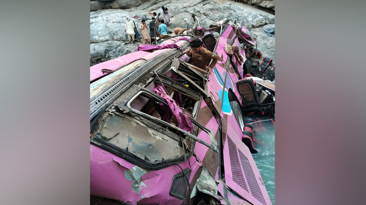 Soldiers and volunteers take part in a rescue work after an overcrowded passenger bus plunged from a highway into a rocky ravine in Pakistan. (Source: Balochistan Emergency Services Department via AP)