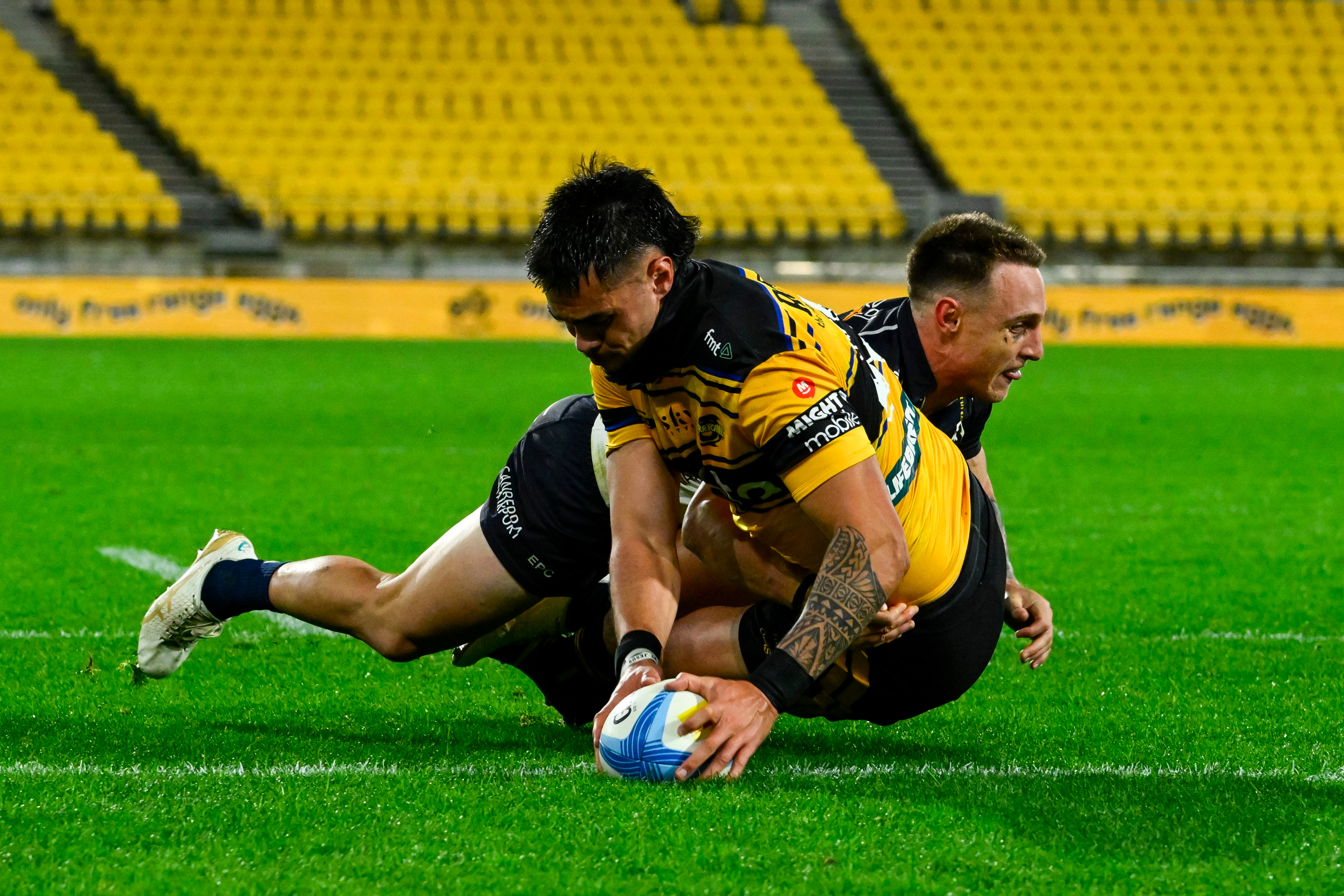 Ngane Punivai of the Hurricanes scores.