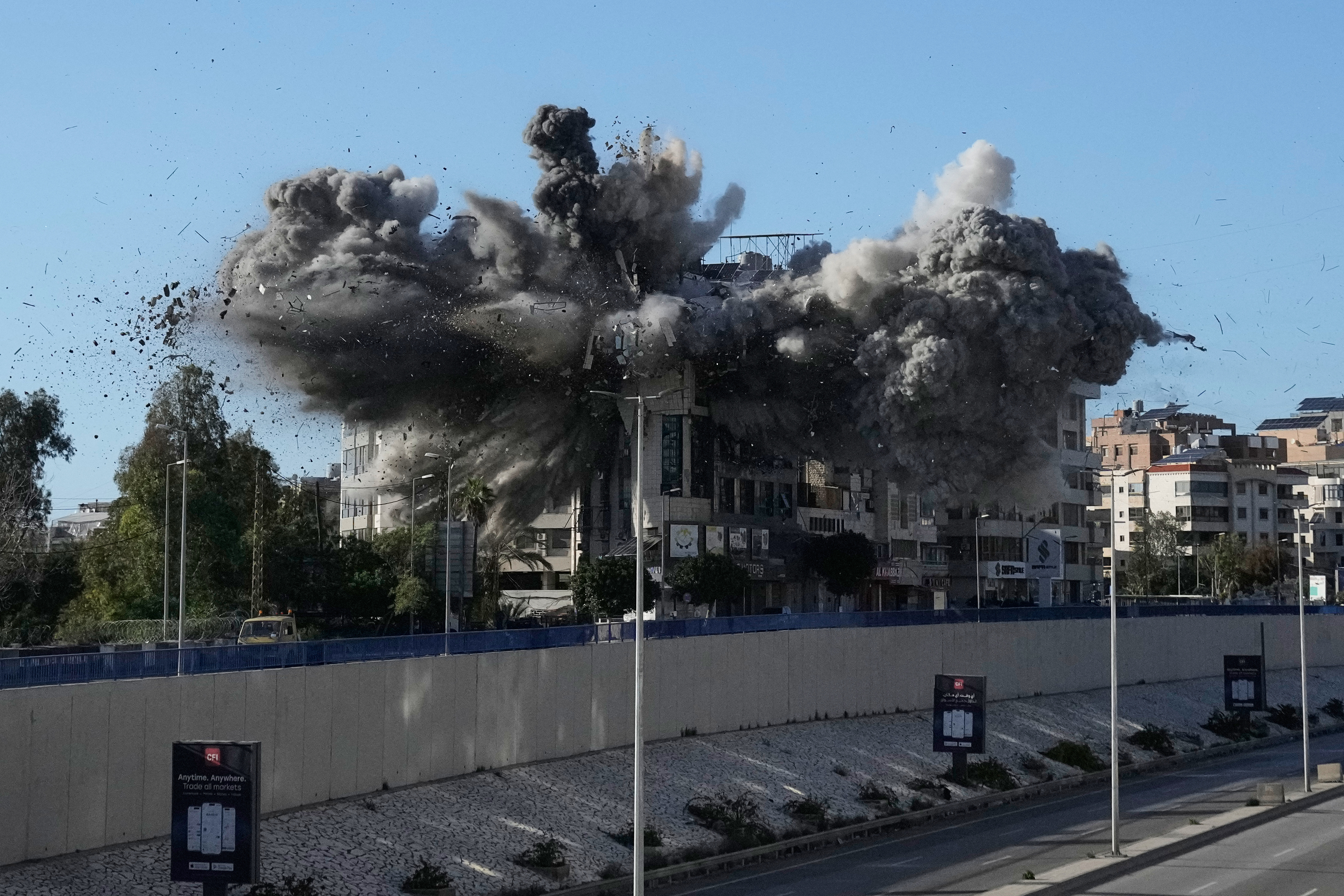 Smoke rises after an Israeli airstrike hits a building near the airport road in Beirut, March 31, 2026.