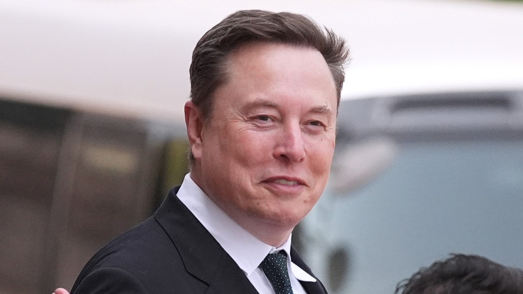 Elon Musk departs after a welcome ceremony with President Donald Trump and China's President Xi Jinping at the Great Hall of the People, Thursday, May 14, 2026, in Beijing. 