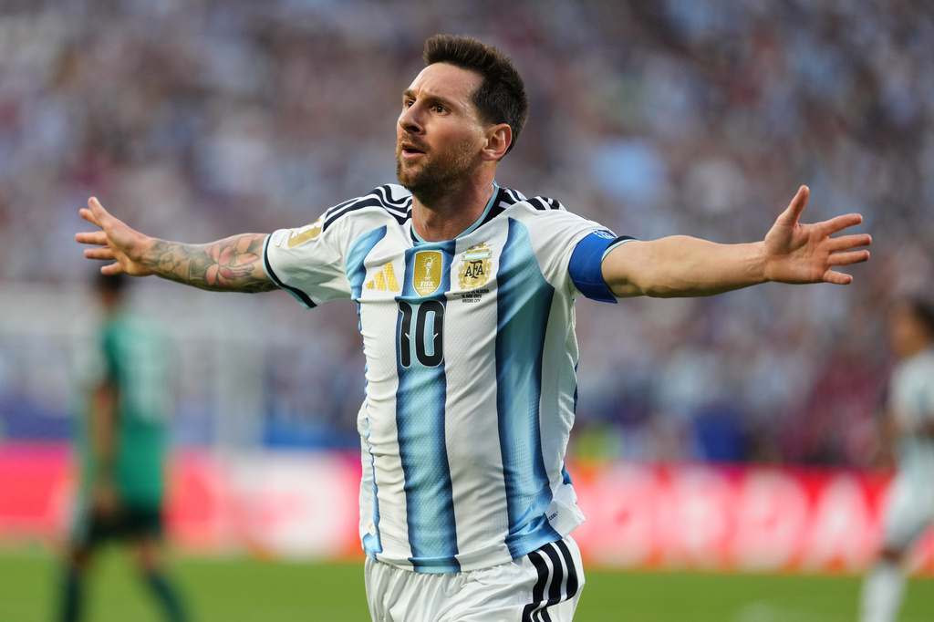 Argentina's Lionel Messi (10) celebrates after scoring the opening goal during the World Cup Group J soccer match between Argentina and Algeria in Kansas City.