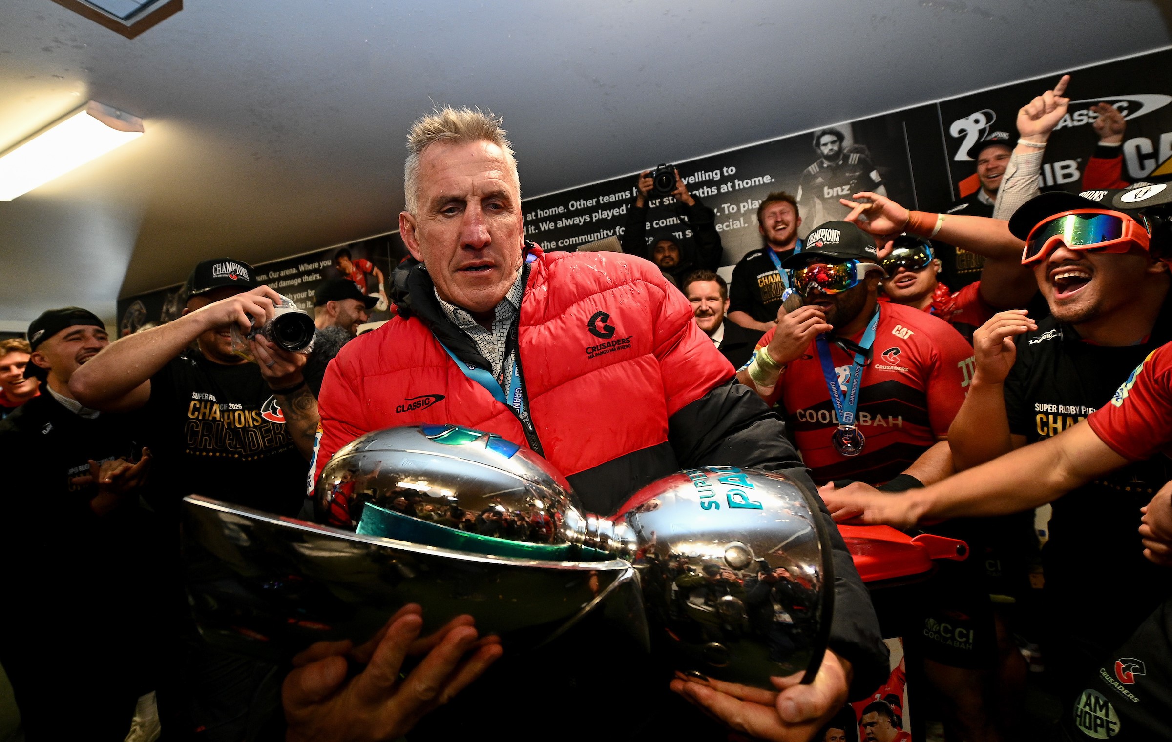 Crusaders head coach Rob Penney celebrates with the Super Rugby Pacific trophy last month.