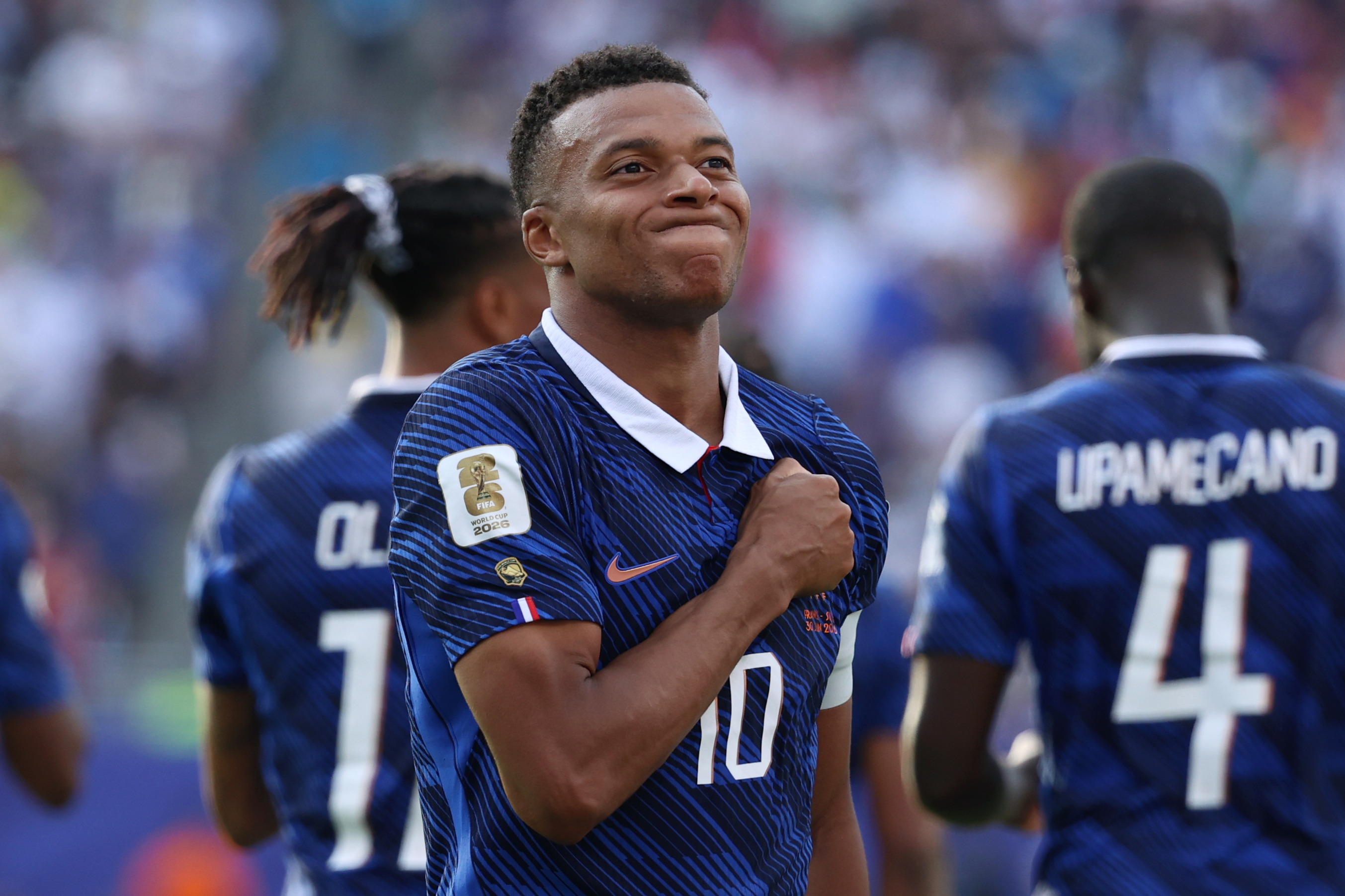 France's Kylian Mbappe (10) celebrates scoring their third goal during the World Cup round of 32 match between France and Sweden. 