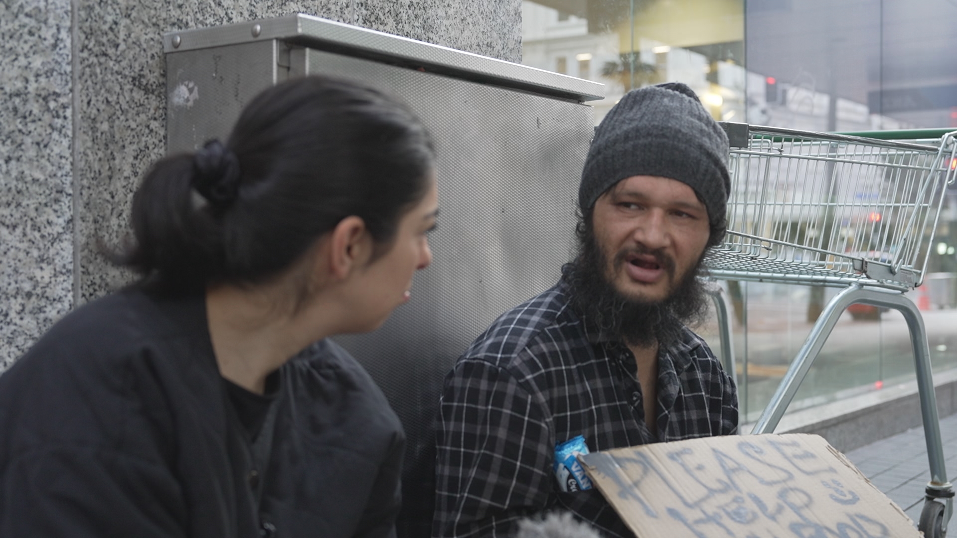 Mava Moayyed discusses the planned law with a man on Auckland's streets. 