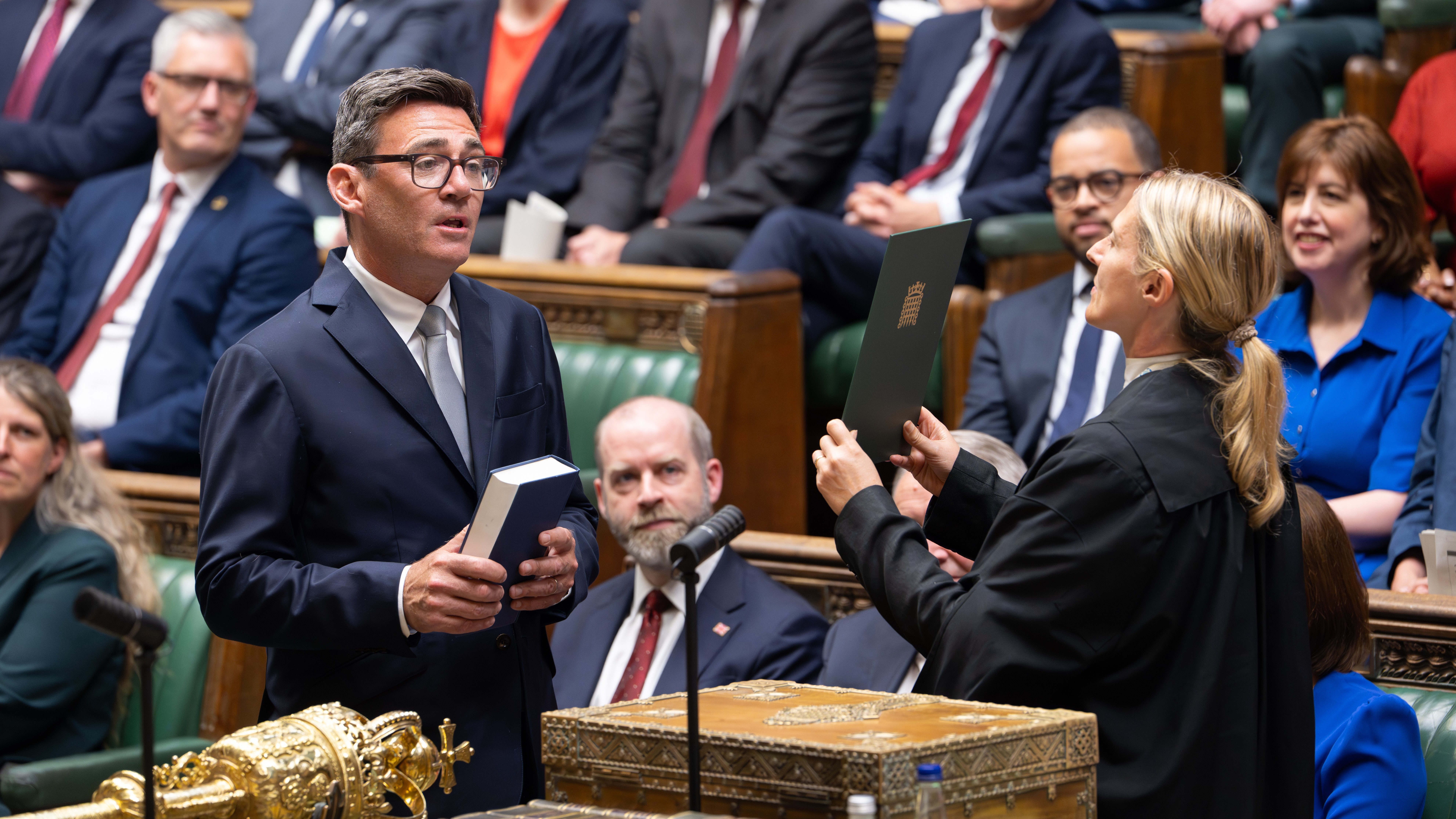 Andy Burnham, front left, is sworn-in as an MP in the House of Common in London, England, Monday, June 22, 2026.