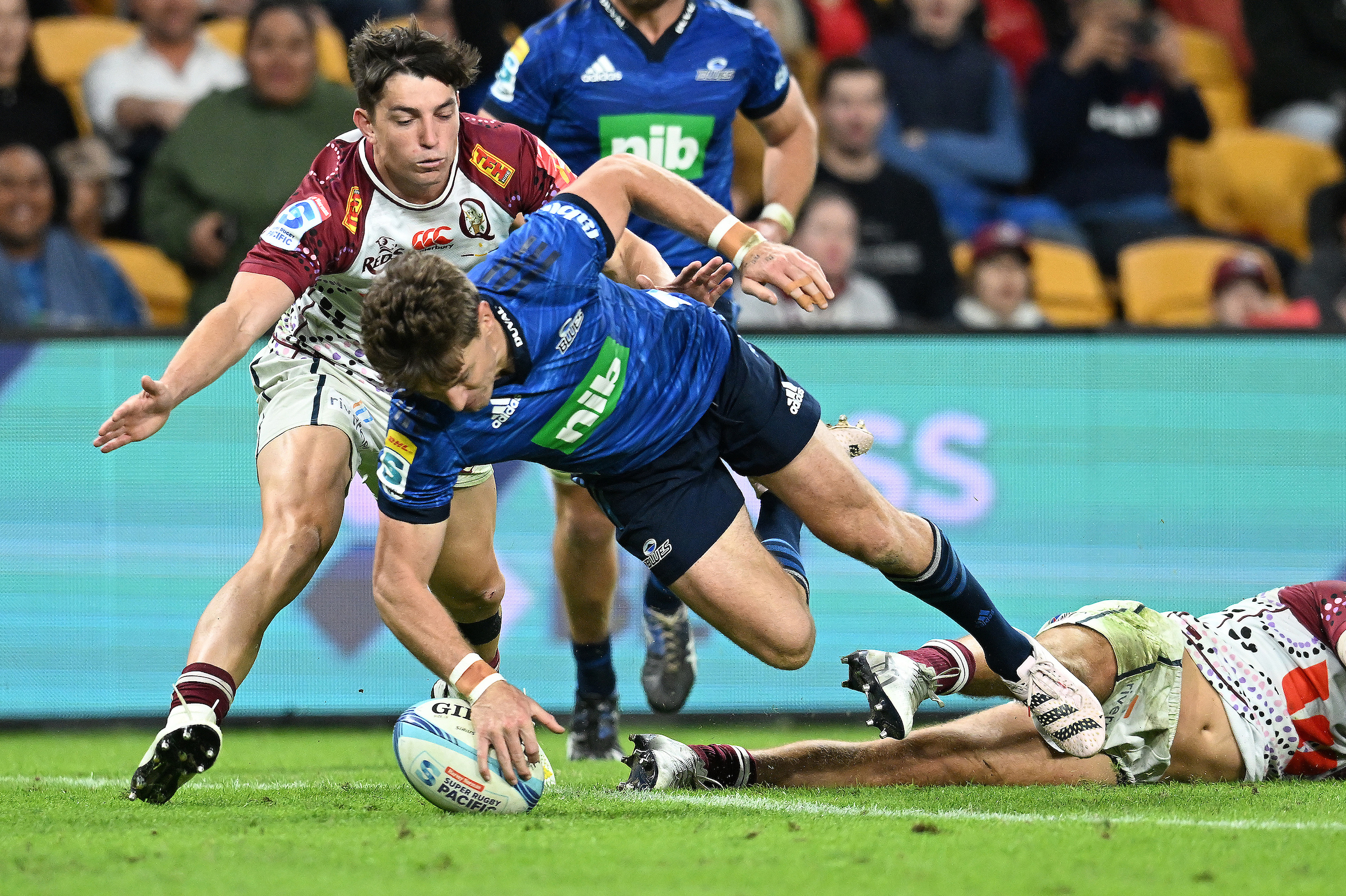 Beauden Barrett scores against the Reds.