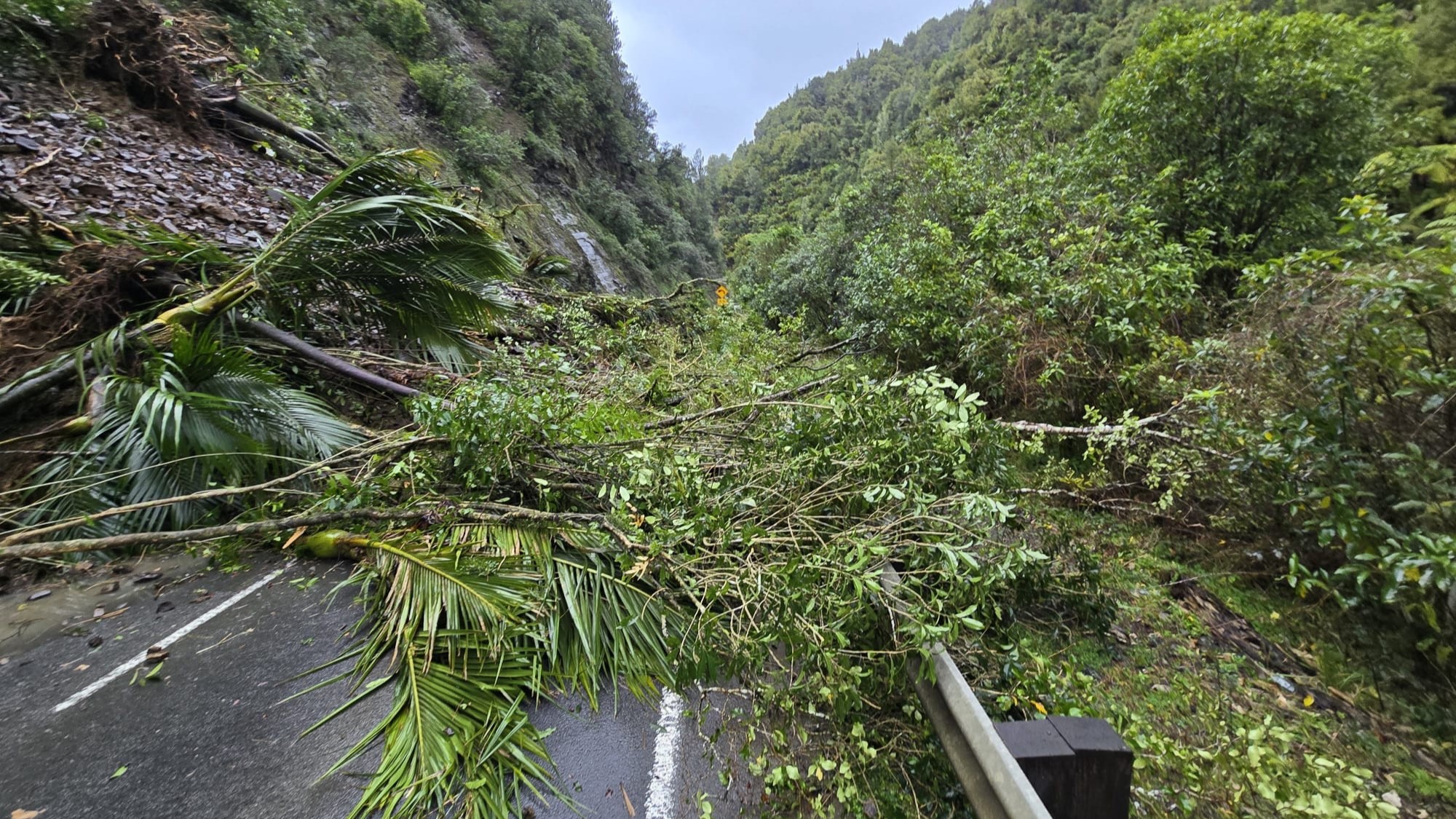 A slip damages State Highway 3 through the Awakino Gorge in northern Taranaki.