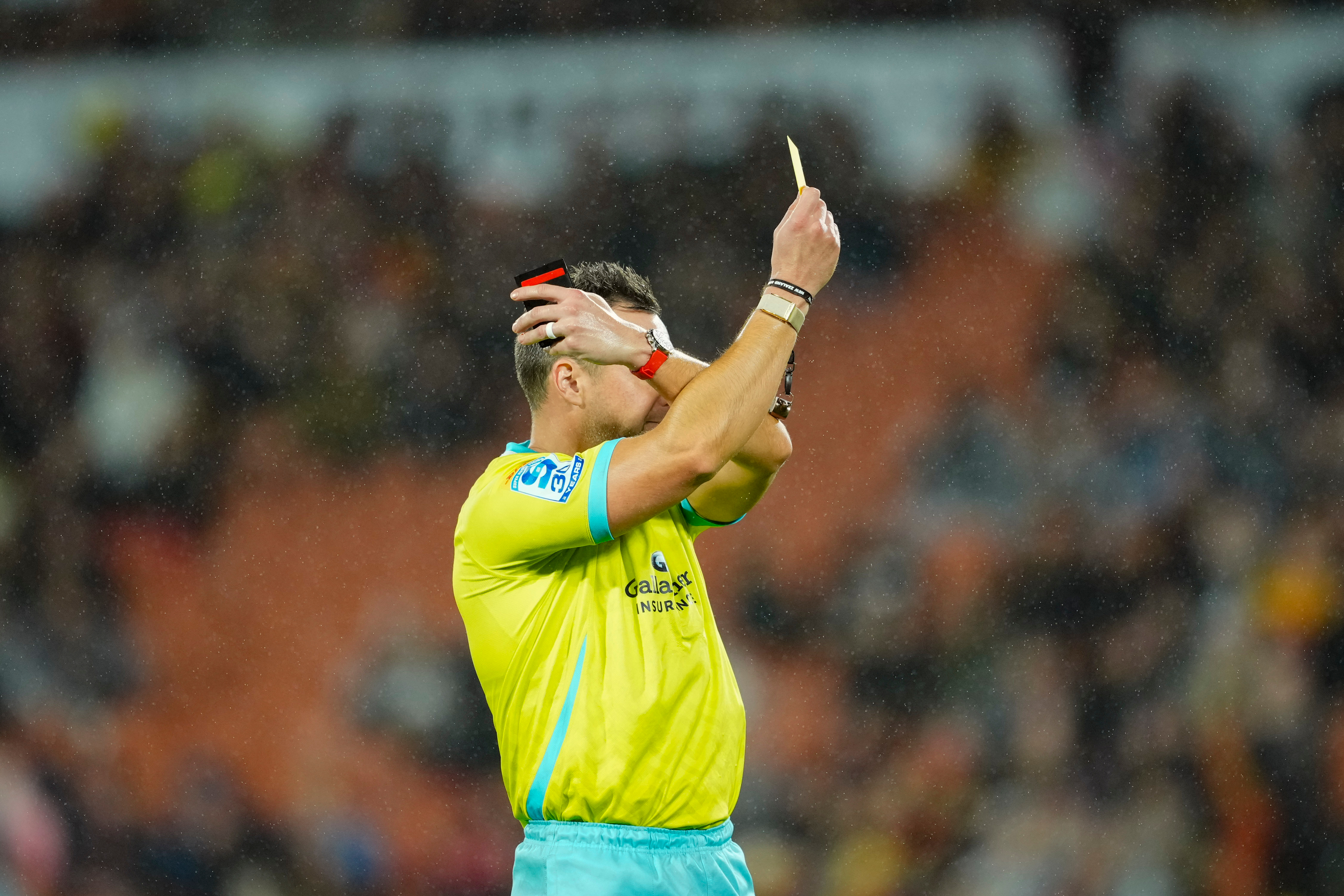 James Doleman issues a yellow card during the Chiefs v Reds Super Rugby Pacific Qualifying Final match at FMG Stadium Waikato 
