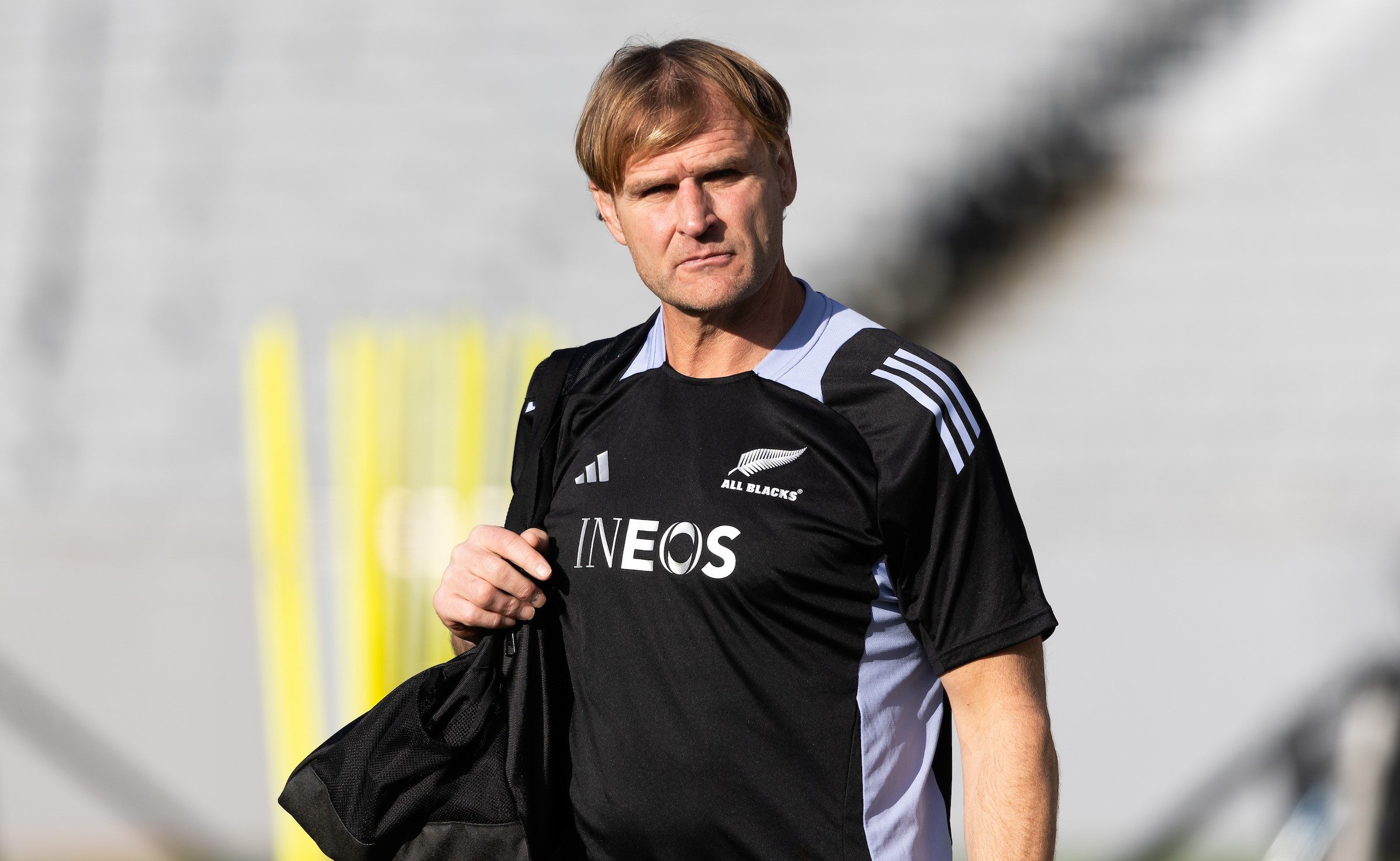 All Blacks coach Scott Robertson in INEOS branded training kit.