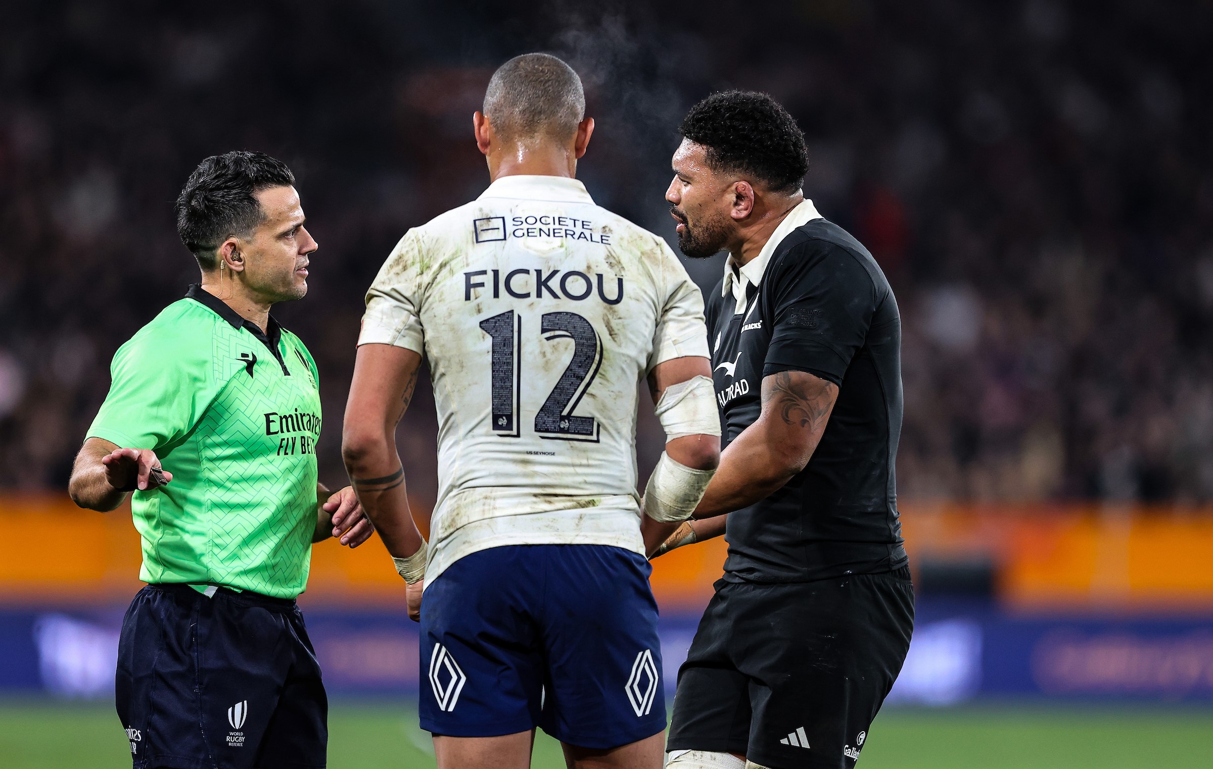 Ardie Savea speaks to referee Nic Berry, with France skipper Gael Fickou in attendance, as Billy Proctor's try is overturned.