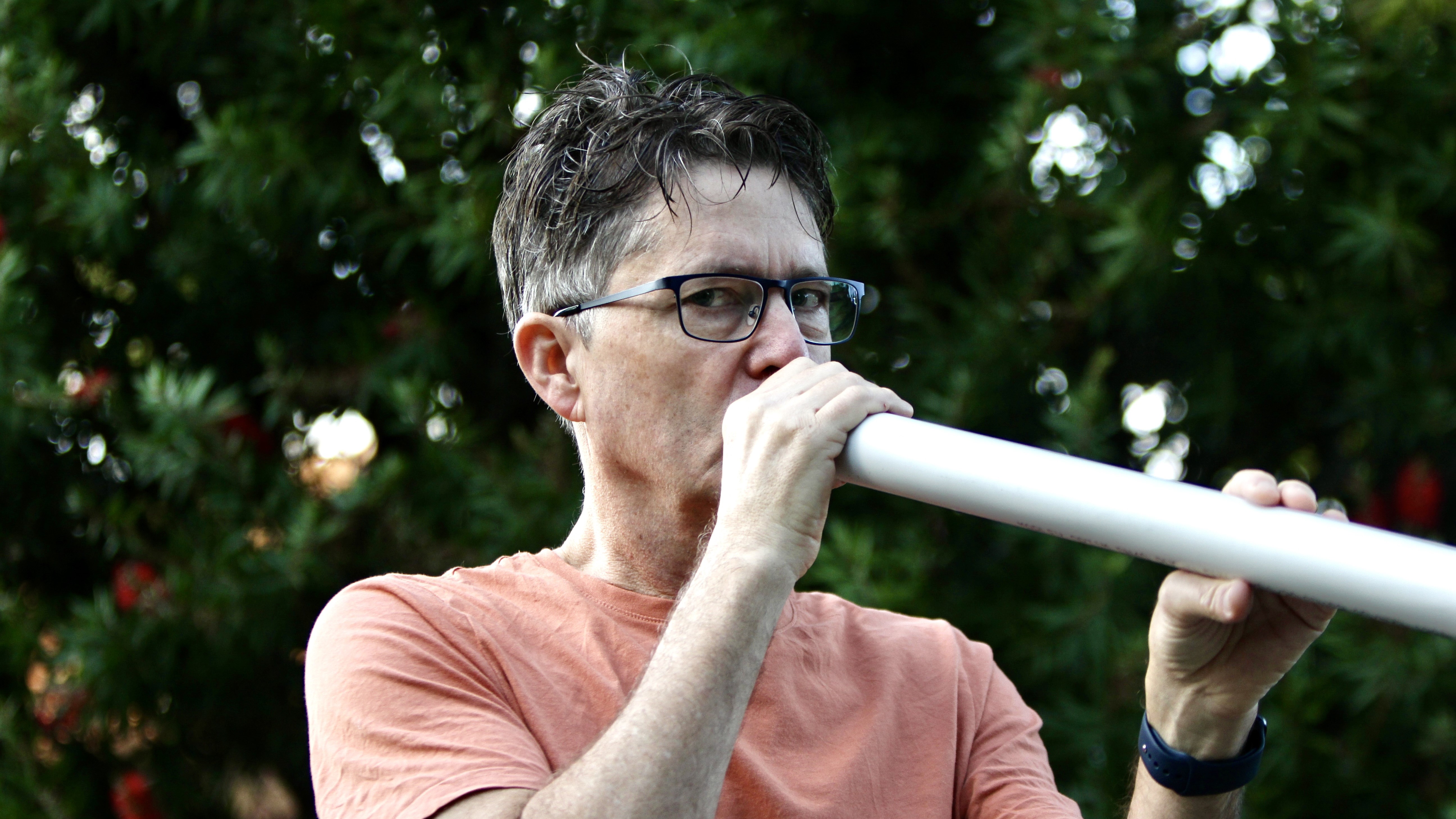Adam Dudding and his makeshift didgeridoo. (Photo: Eliza Ferguson-Dudding)