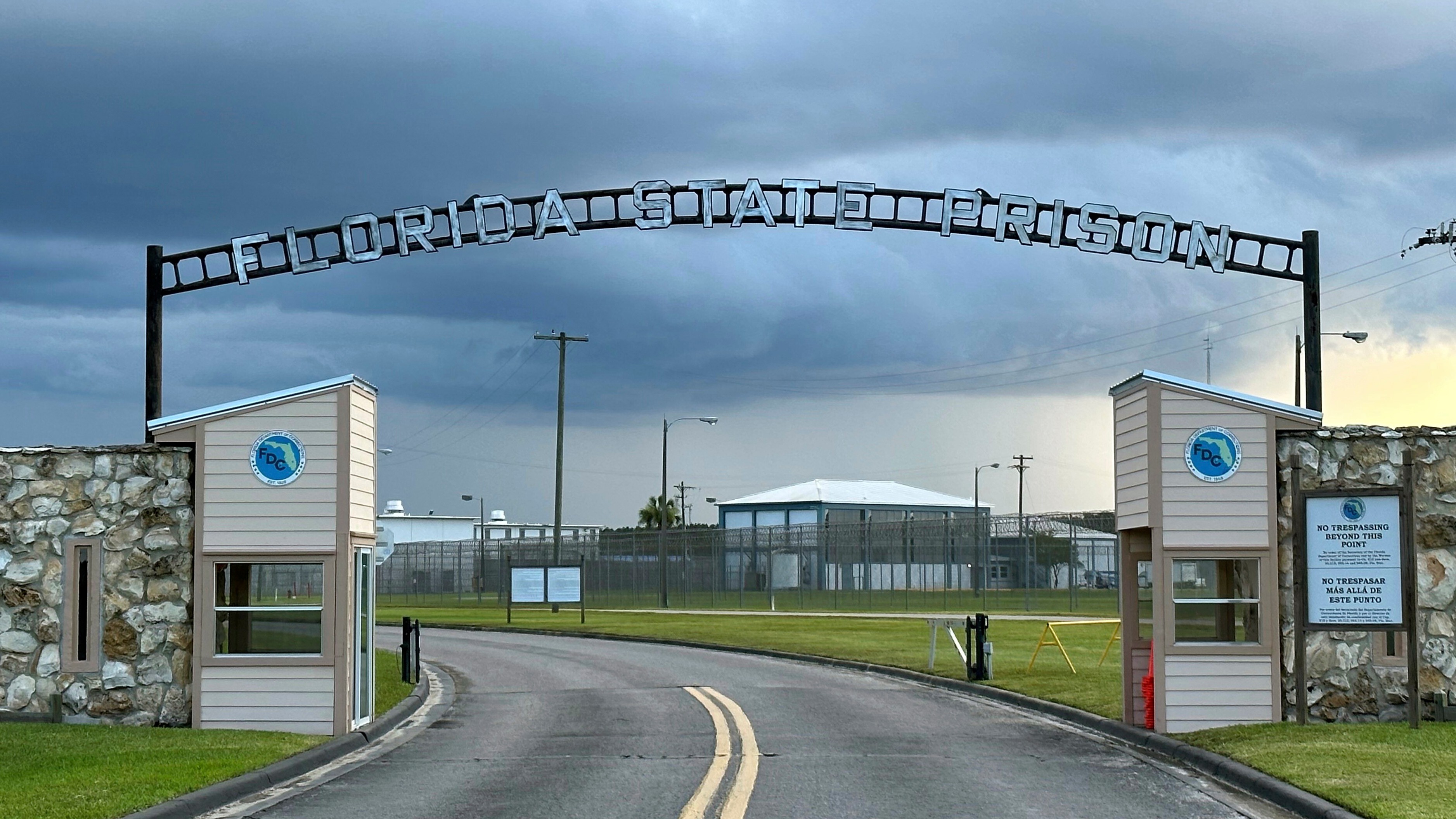 Clouds hover over the entrance of the Florida State Prison in Starke, Fla., Aug. 3, 2023.