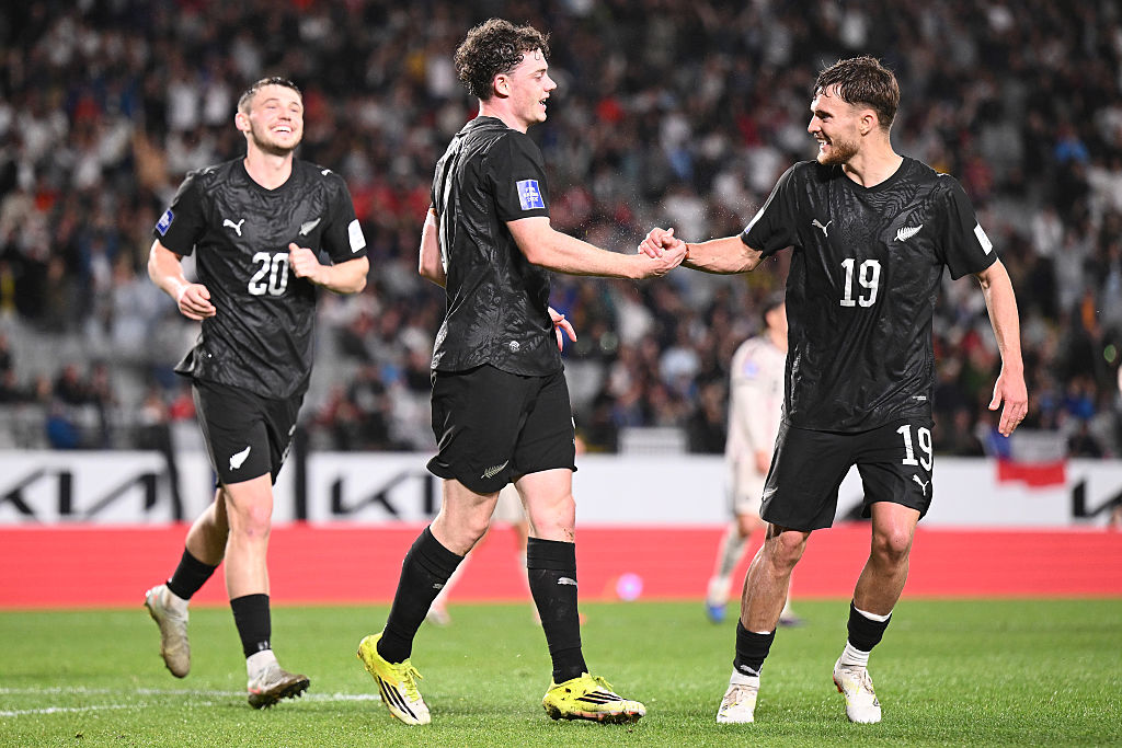 Jesse Randall of New Zealand celebrates with team mate Ben Old