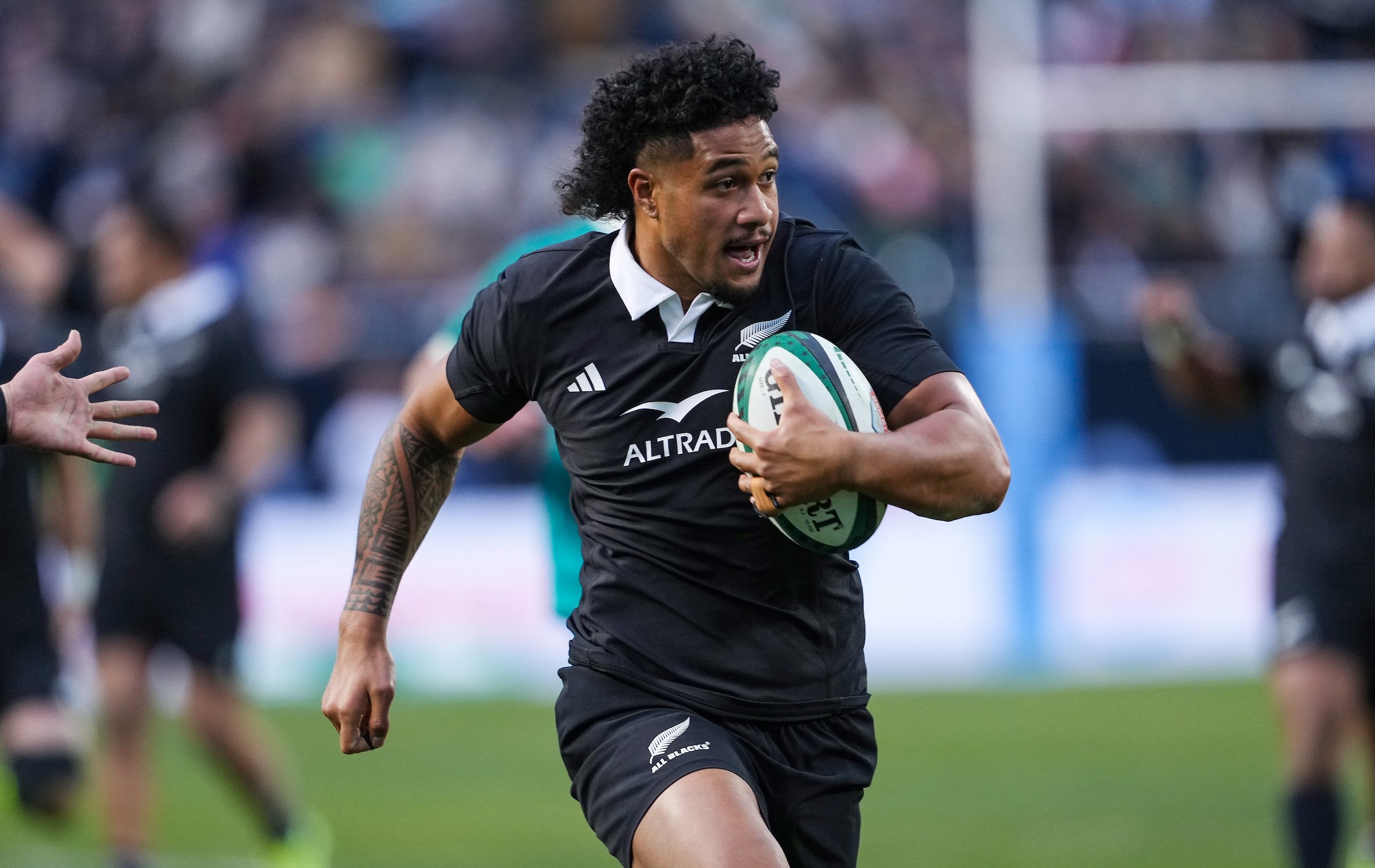 Leicester Fainga'anuku makes a break for the All Blacks against Ireland in Chicago.
