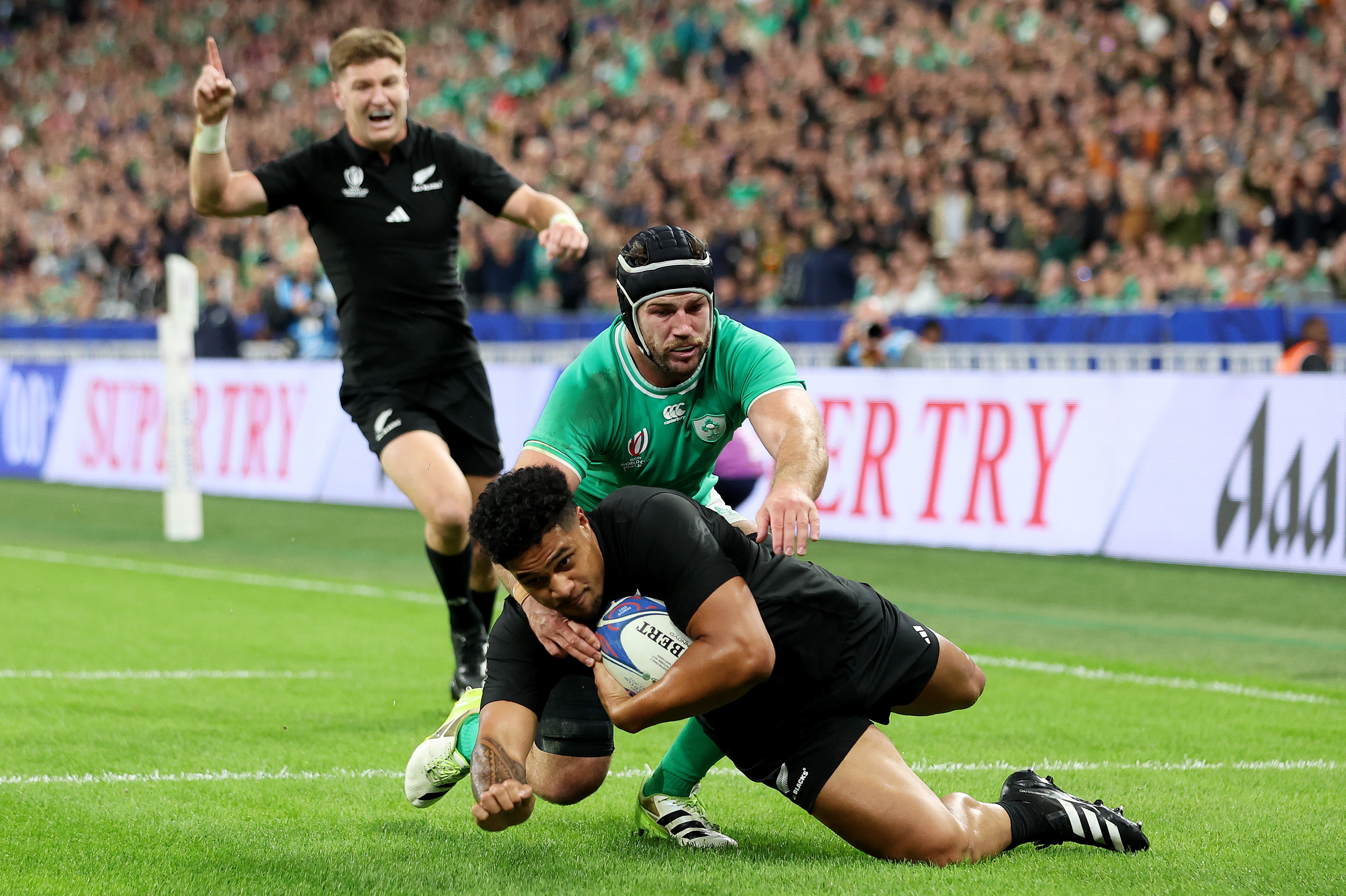 Jordie Barrett celebrates Leicester Fainga'anuku's try for the All Blacks which helped them to a13-0 lead over Ireland.