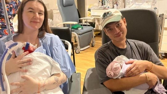 Billy Samountry and his partner Jesse with their newborn twin girls, Lyra Mae and Juniper Mira. 
