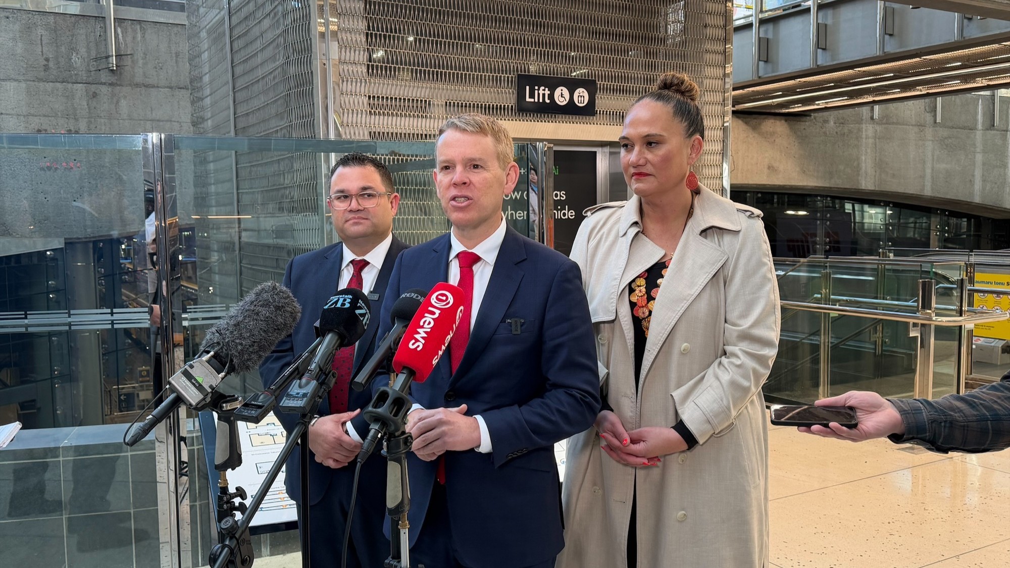 Labour leader Chris Hipkins speaks alongside  spokesperson for transport Tangi Utikere and spokesperson for Auckland Carmel Sepuloni. 