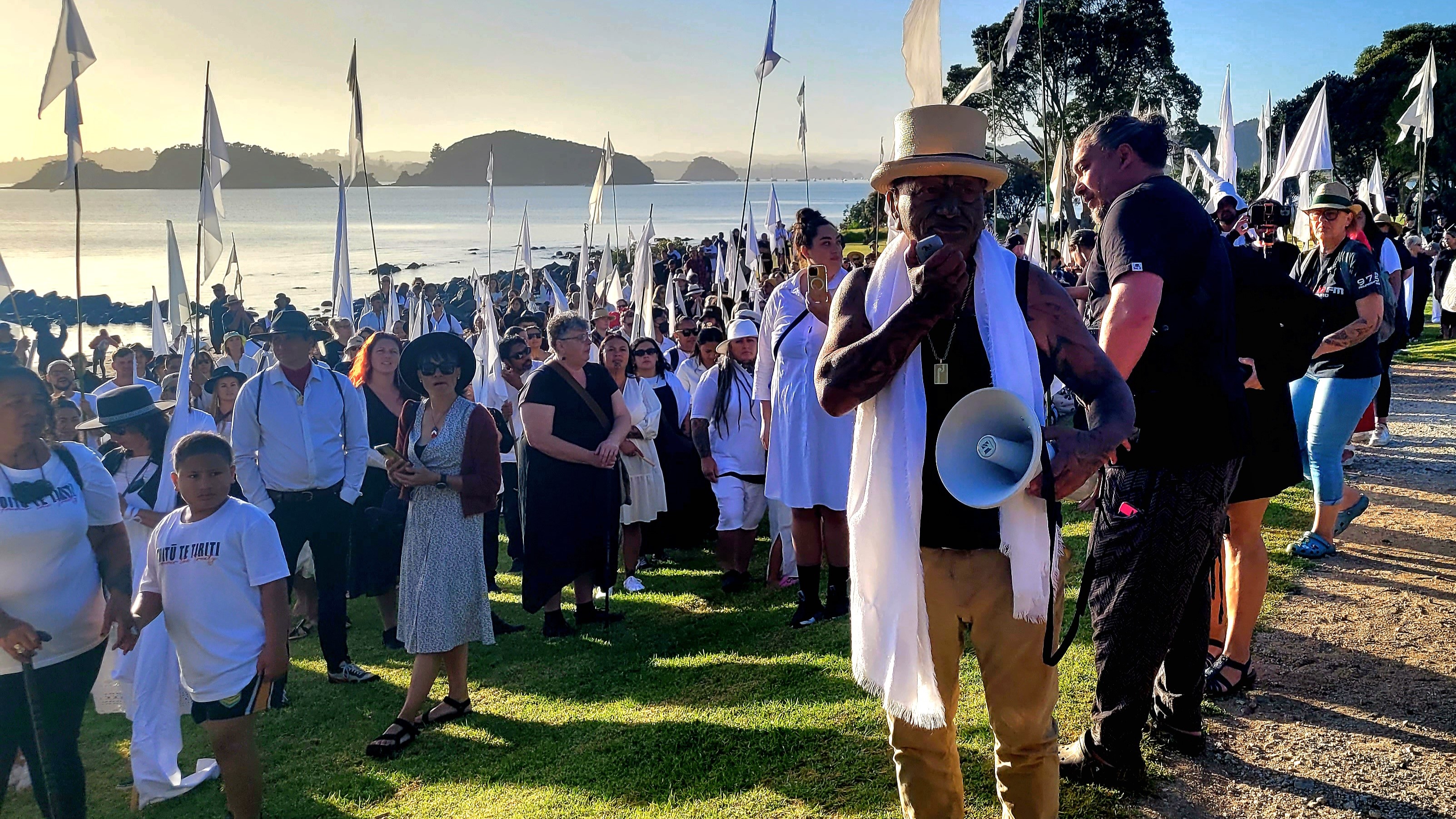 Tāme Iti (with megaphone) and his striking art hikoi, walking up to Te Whare Rūnanga. 