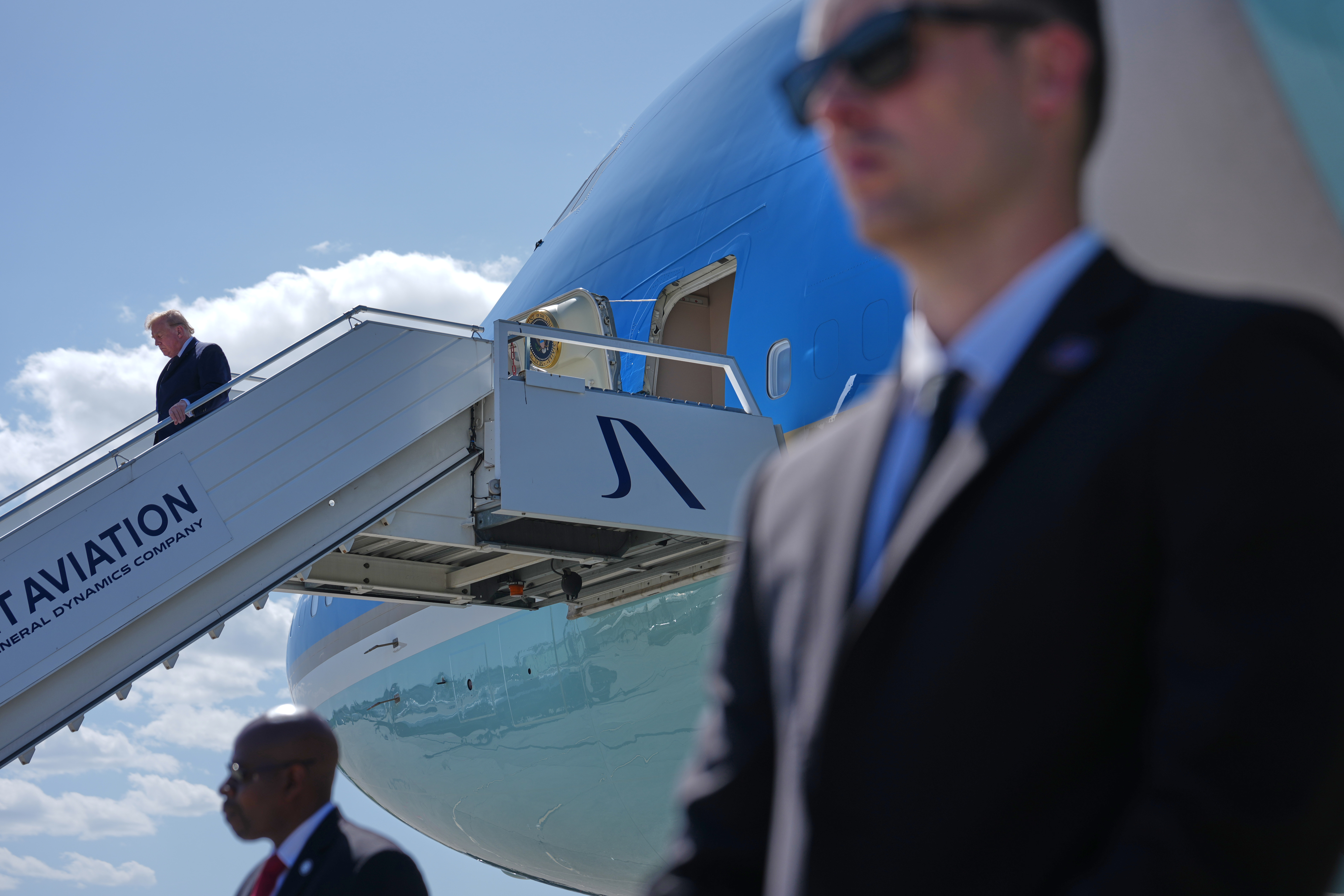 President Donald Trump disembarks Air Force One at Geneva Airport, ahead of the G7 Summit in France.
