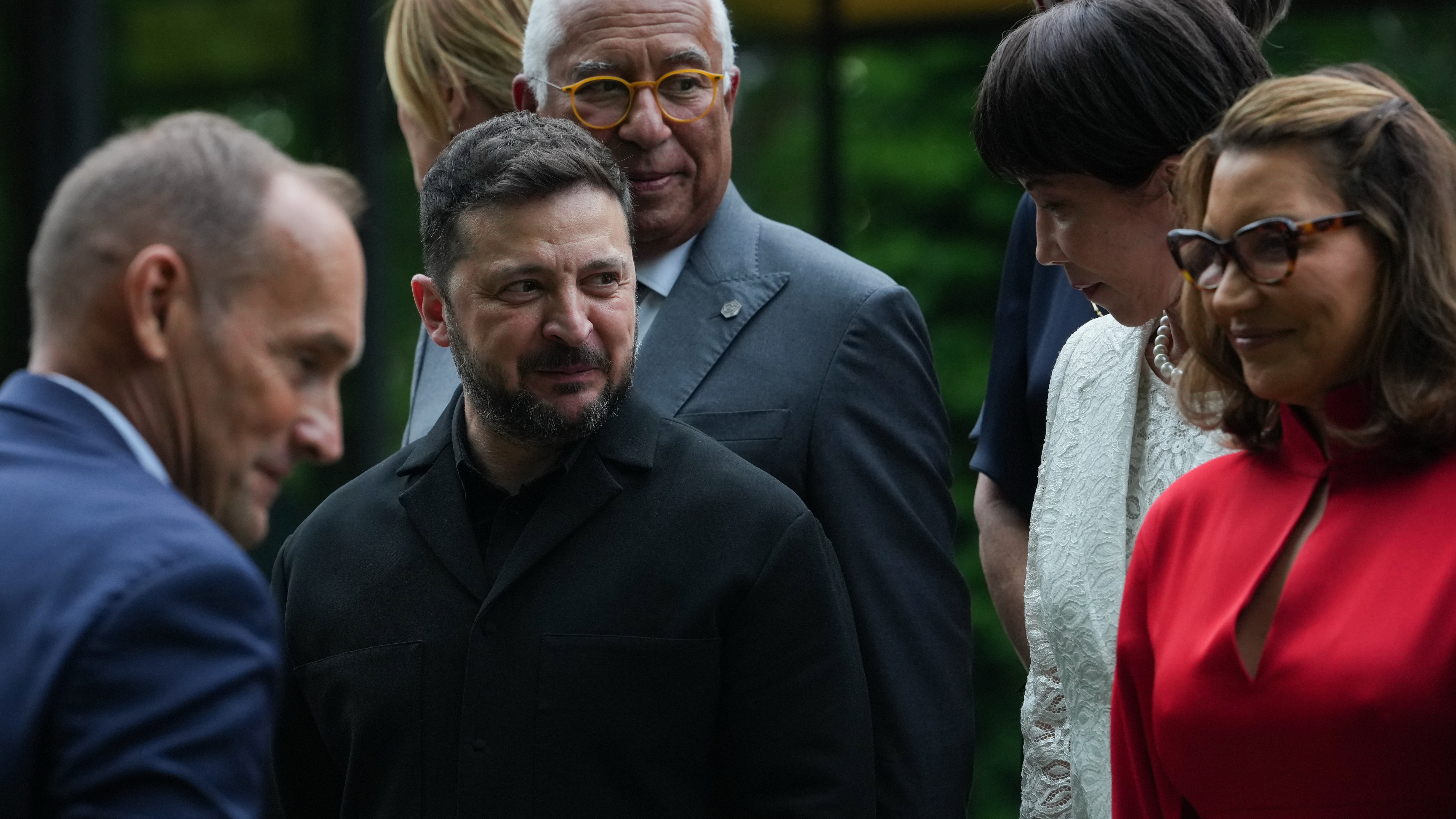 European Council President Antonio Costa, Ukrainian President Volodymyr Zelensky, Japan's Prime Minister Sanae Takaichi and others gather for a group photo at the G7 summit.