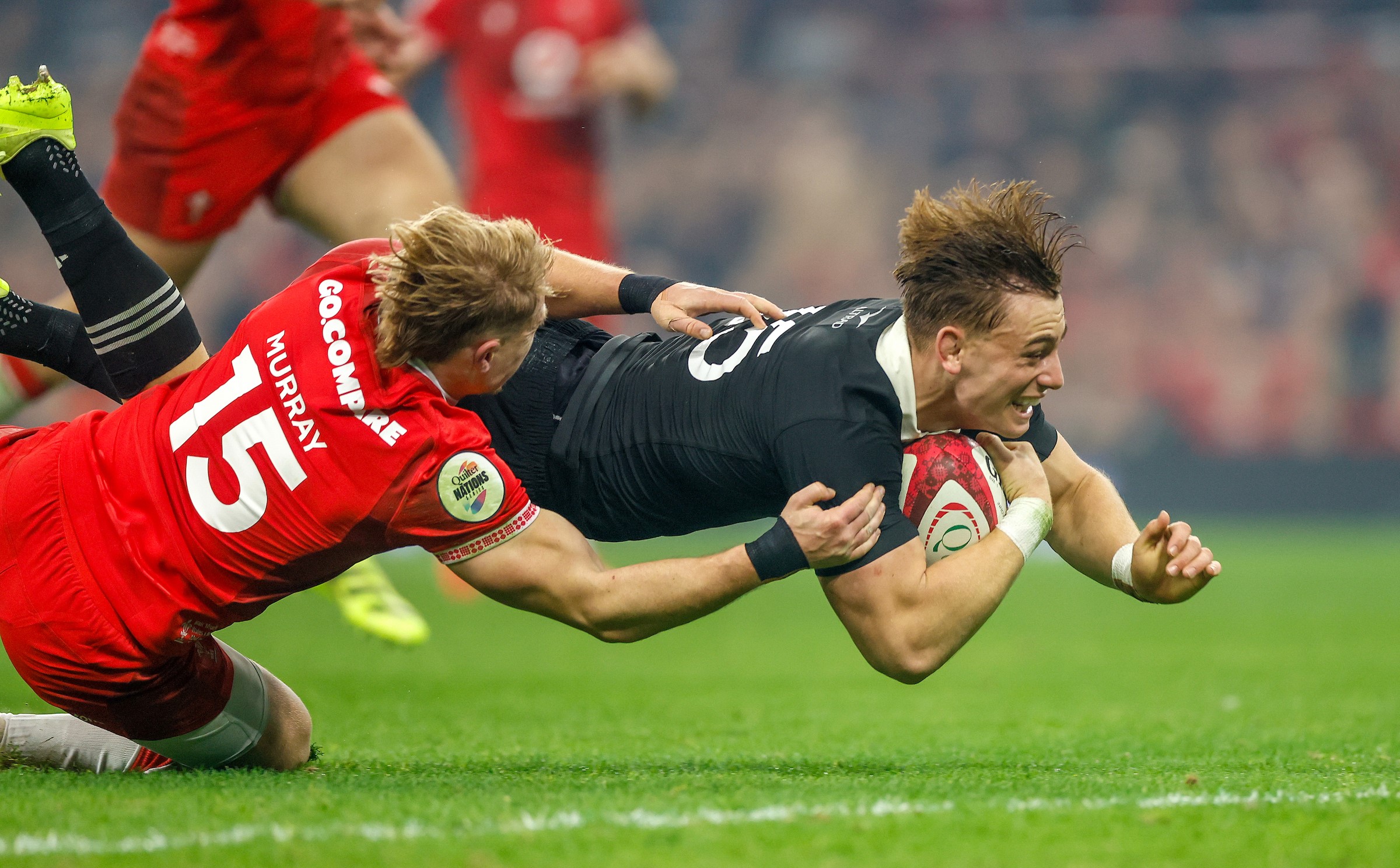 All Blacks fullback Ruben Love crosses for a try against Wales.