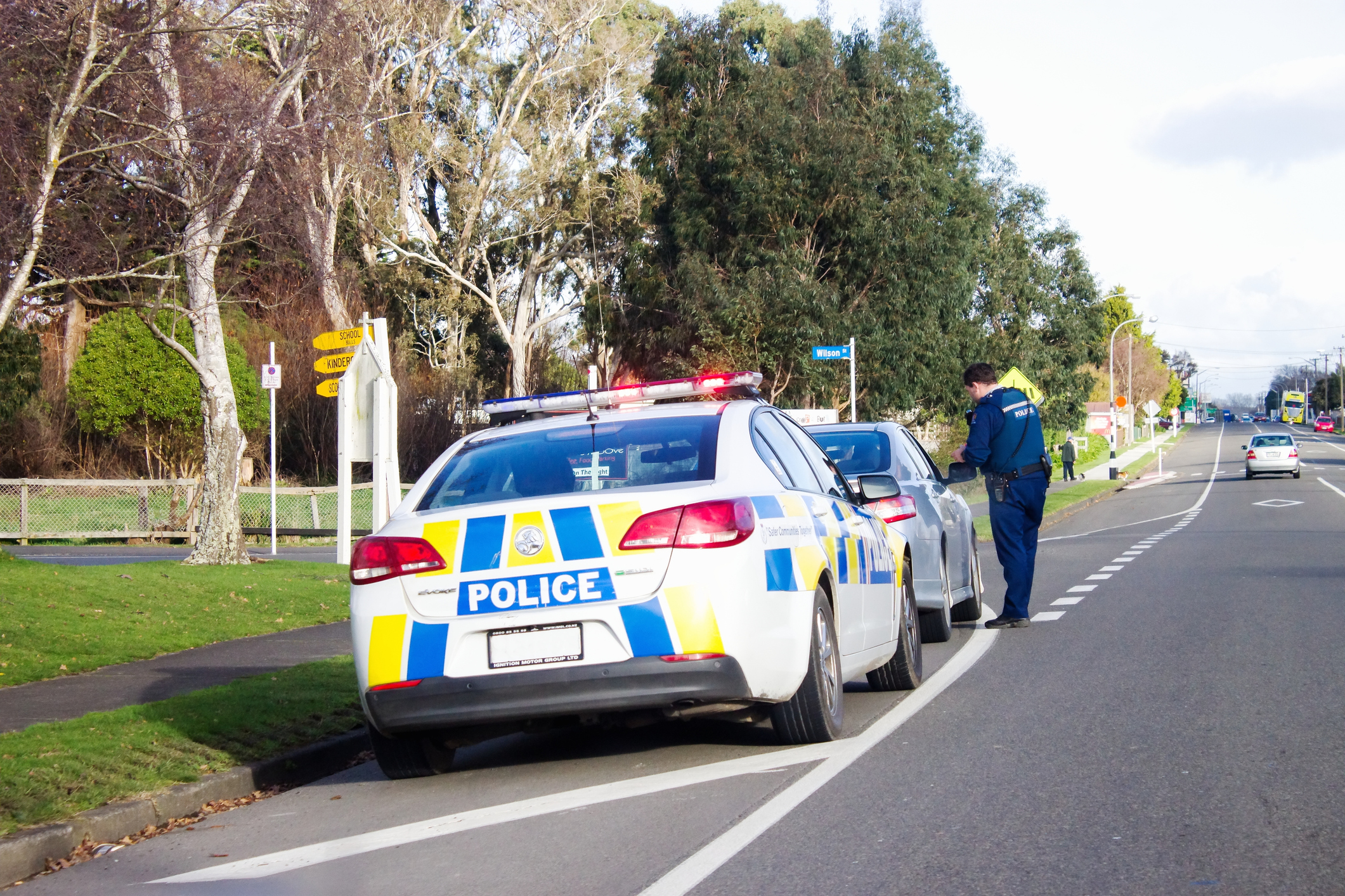 A police officer pulls over a driver. 