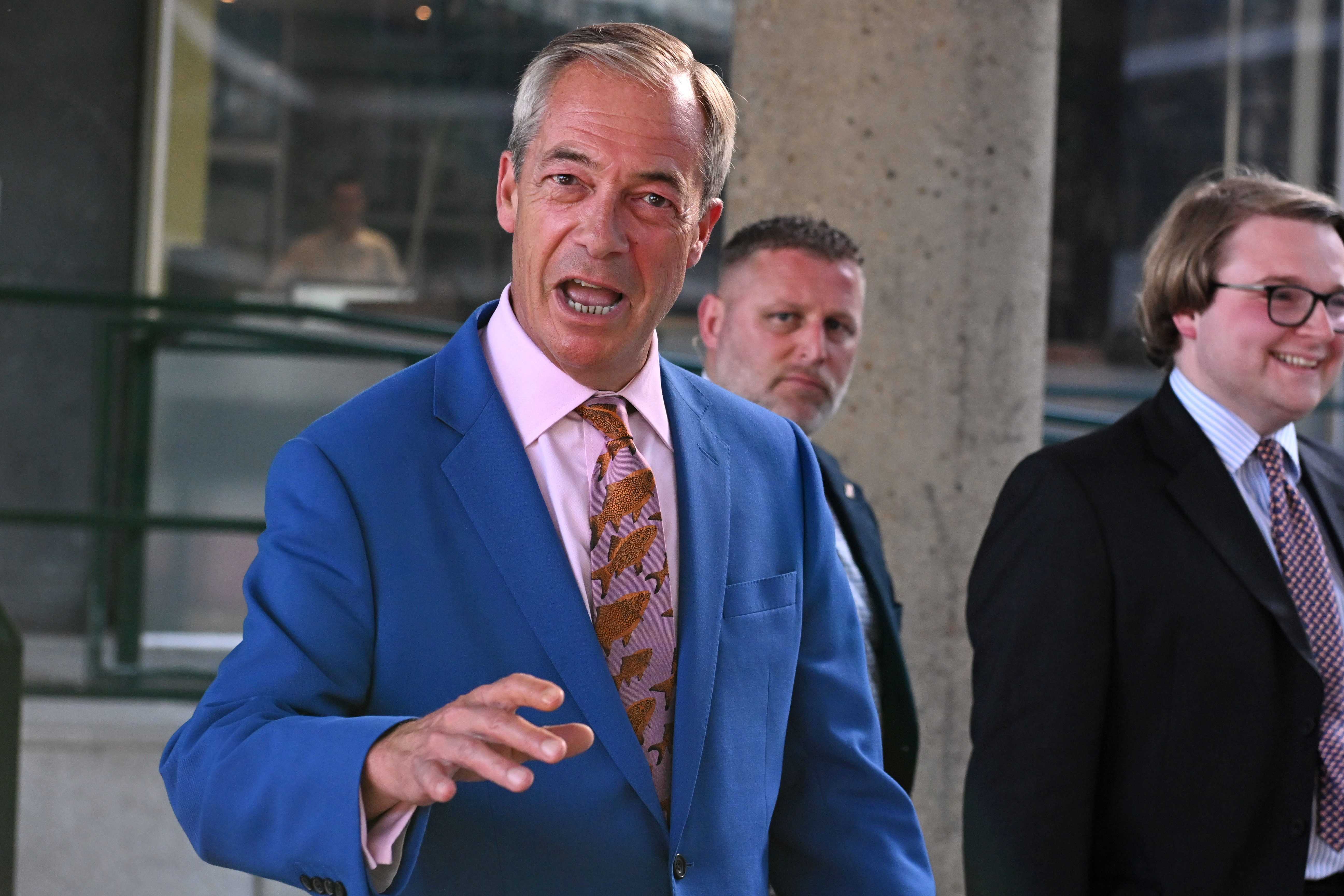 Britain's Reform UK leader Nigel Farage leaves Milbank Tower after he said he'll quit his Parliament seat and seek reelection in London.