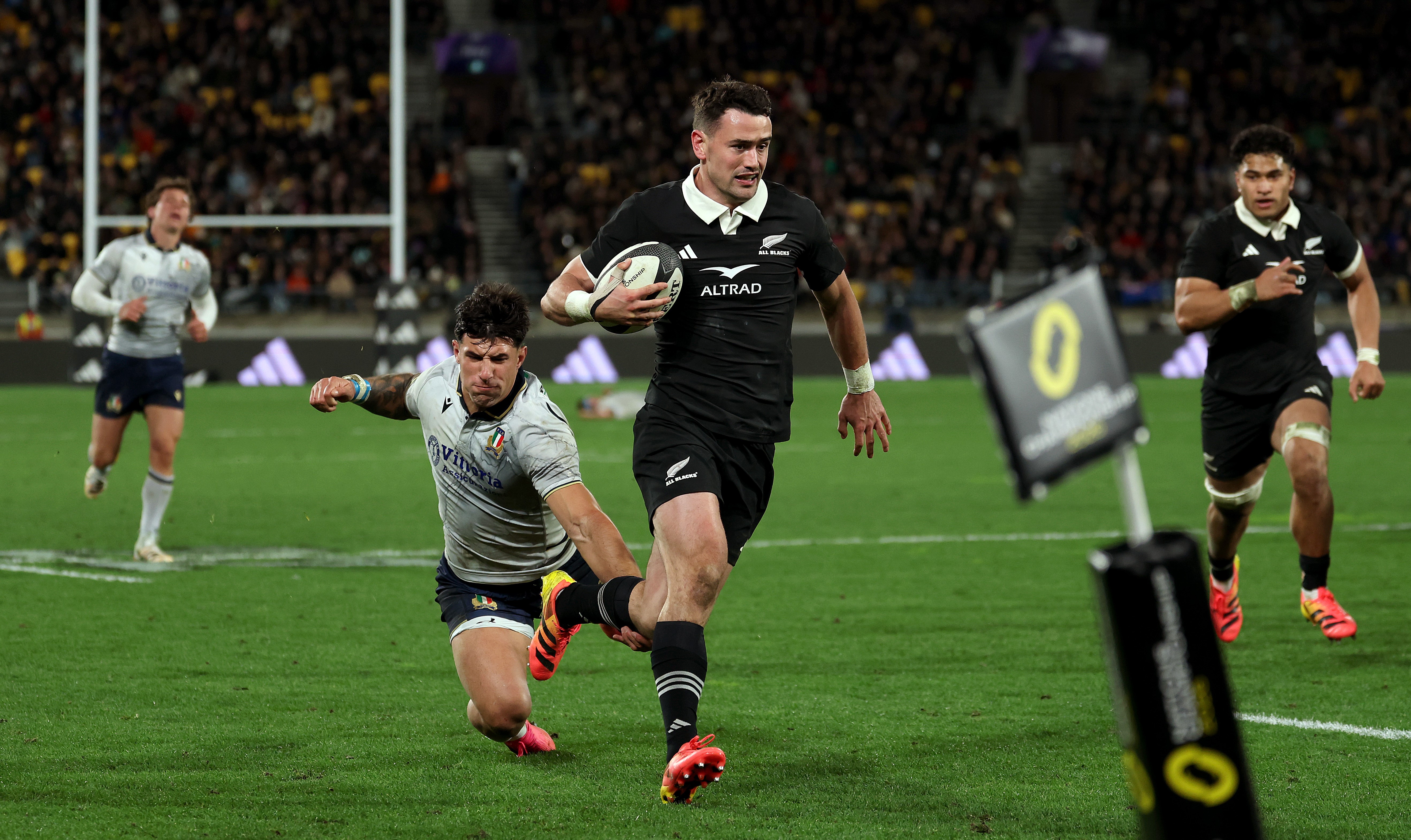Will Jordan runs in for one of his three tries against Italy.