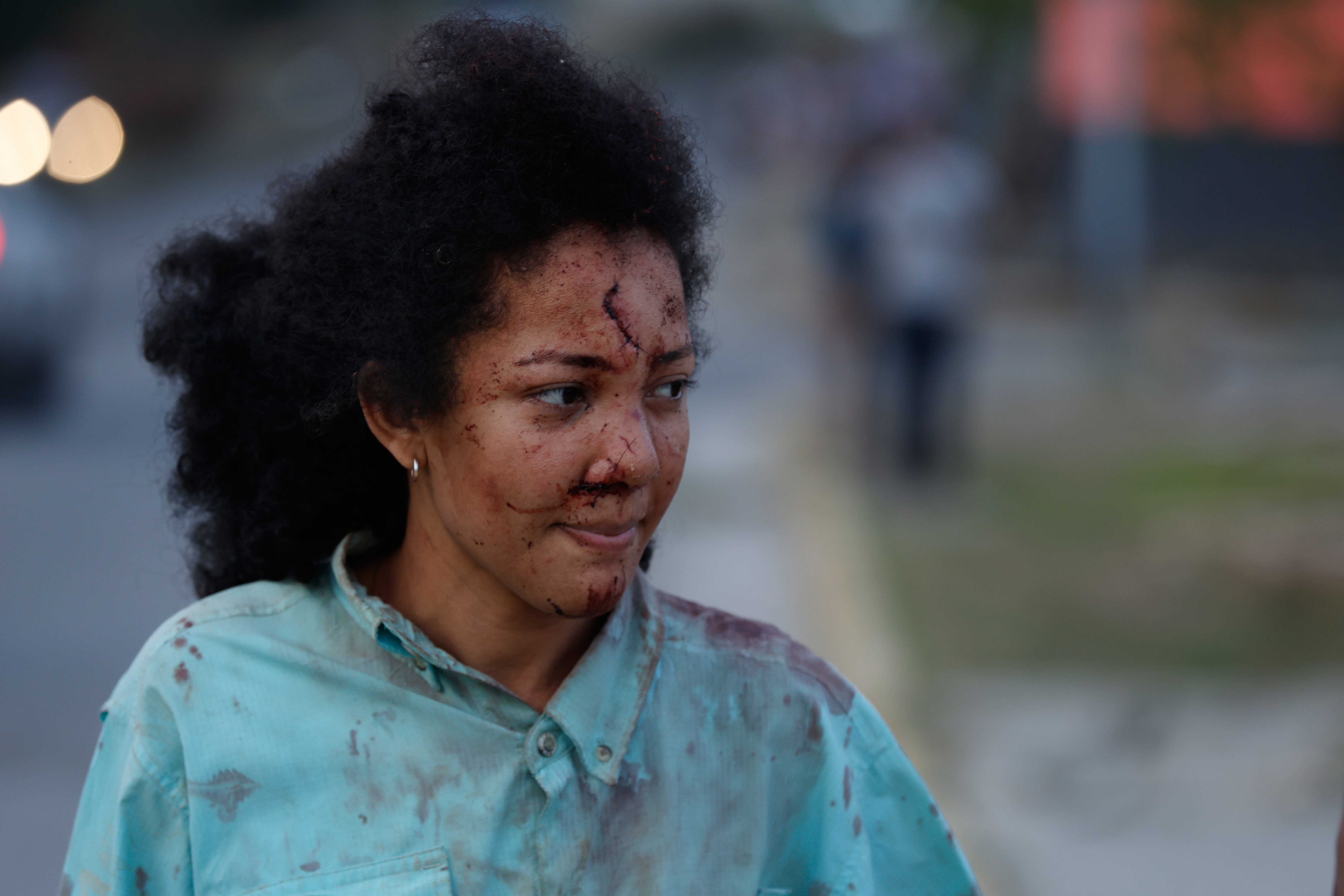 An injured woman walks in La Guaira, Venezuela, a day after an earthquake struck the area, Thursday, June 25, 2026.